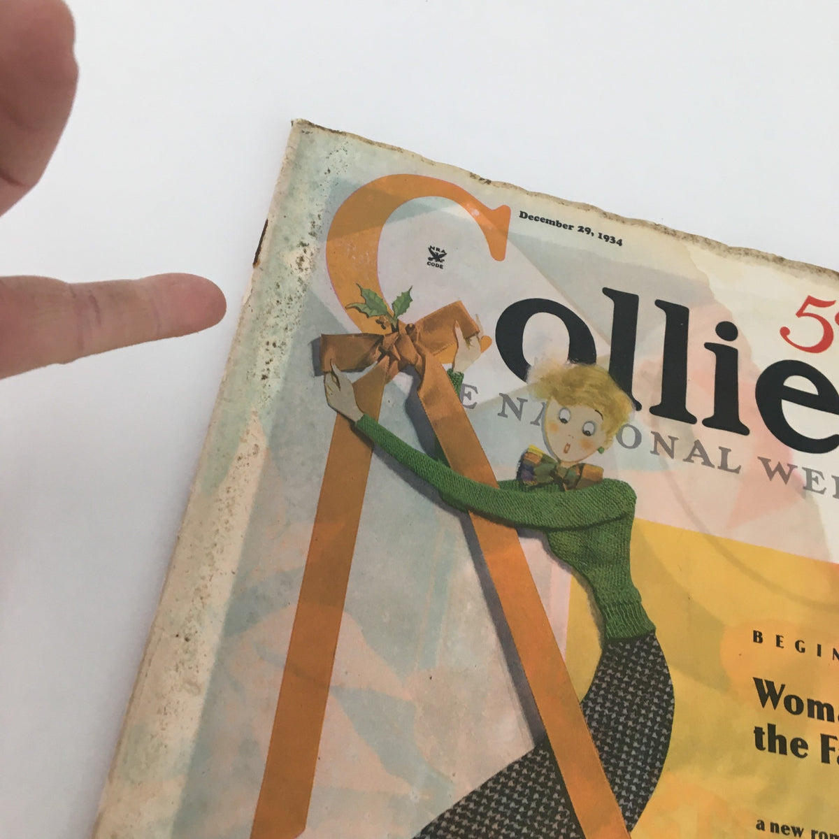 Close-up of the cover of VTG Collier's Magazine December 29 1934, featuring a vibrant illustration and decorative bow, part of the collection that includes the story 'Woman of the Family' by May Edginton.