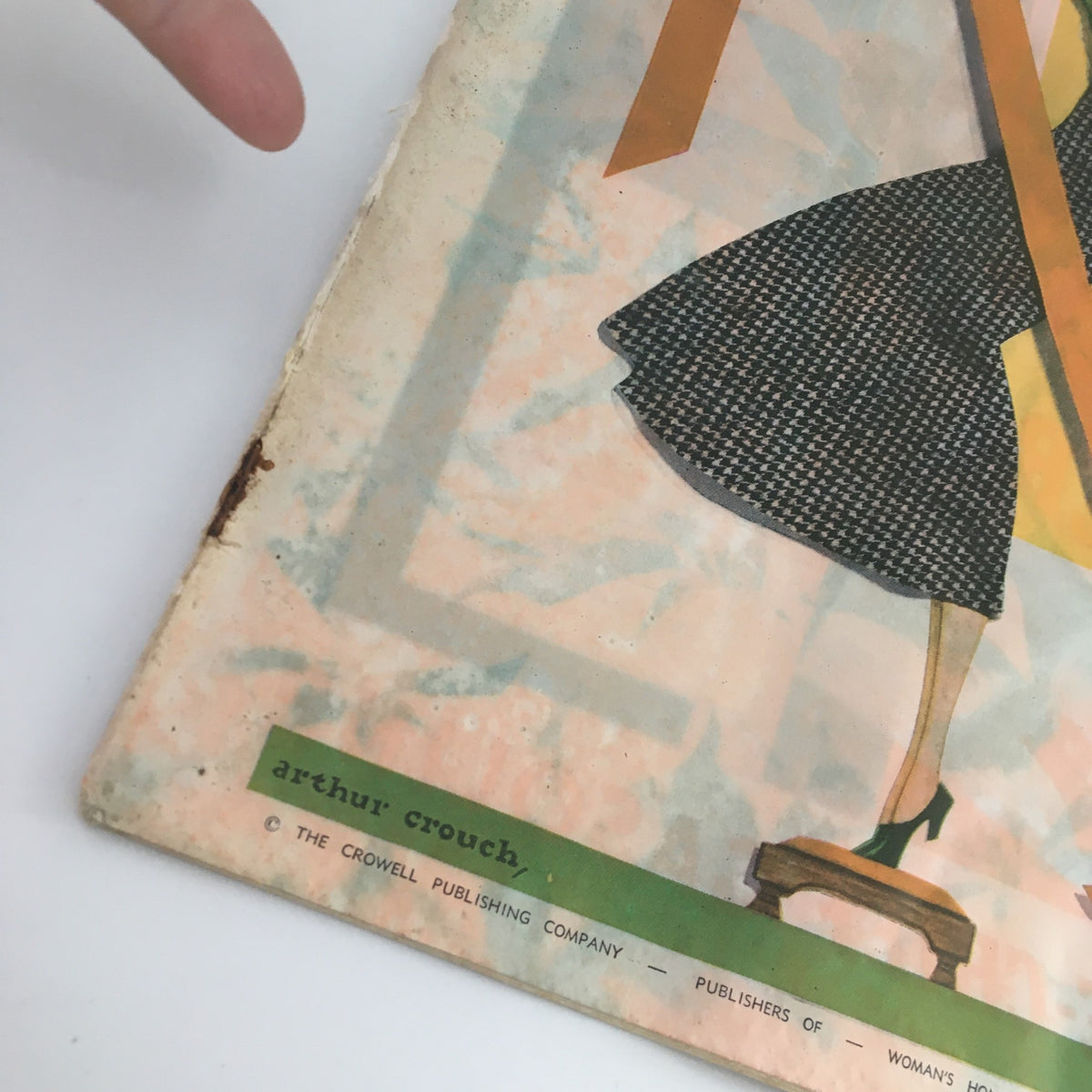 Detail of the bottom corner of VTG Collier's Magazine December 29 1934, showcasing the magazine's publisher information and additional design elements, part of a vintage collection including the story 'Woman of the Family' by May Edginton.
