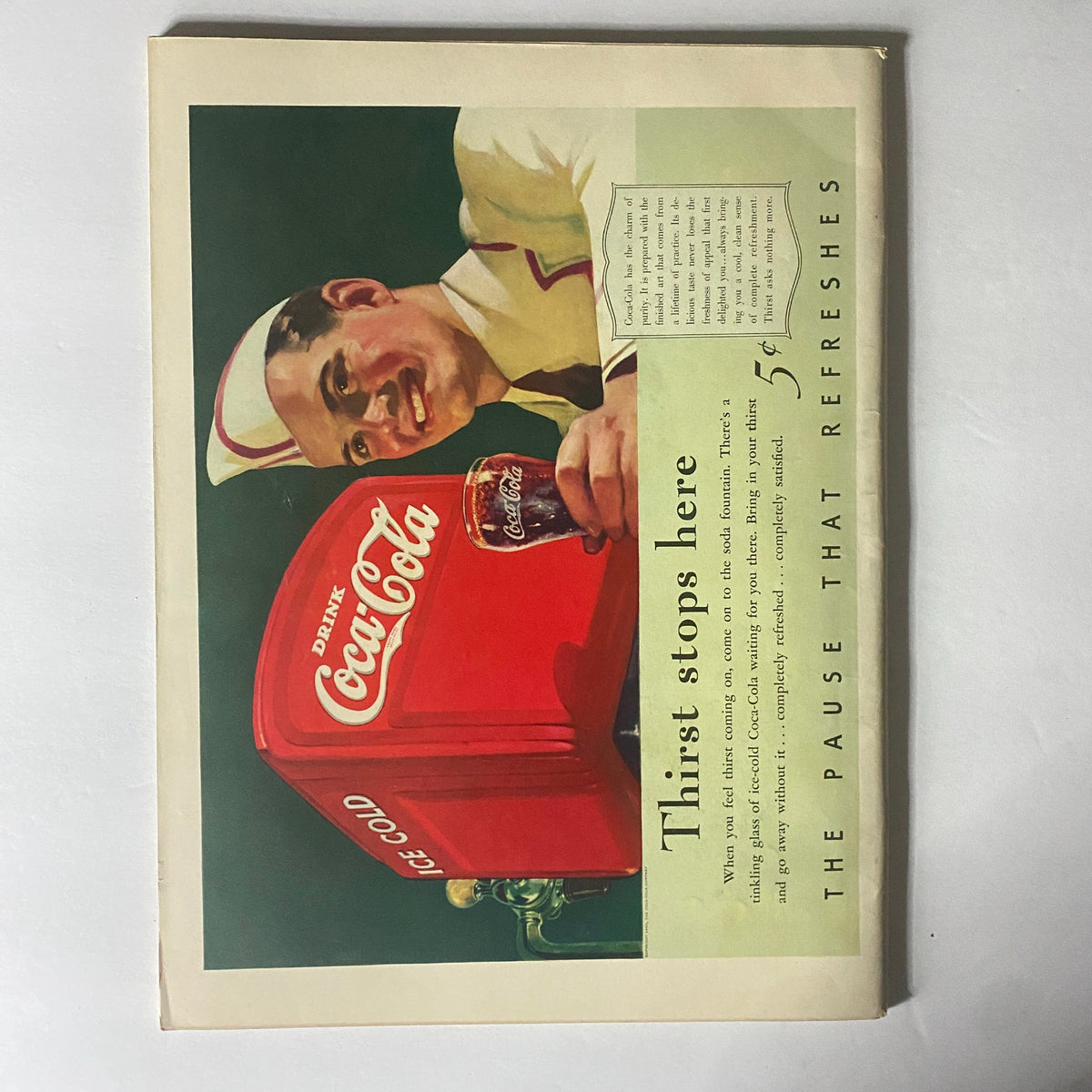 Back cover of Life Magazine May 6, 1940 featuring a vintage Coca-Cola advertisement with a smiling soda jerk promoting the drink.