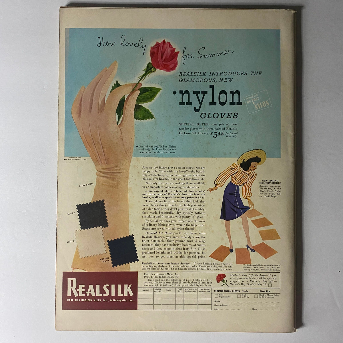Advertisement for Realsilk nylon gloves from Life Magazine April 14, 1941, showcasing a woman's hand holding a rose, emphasizing the glamorous new gloves with special offer details.