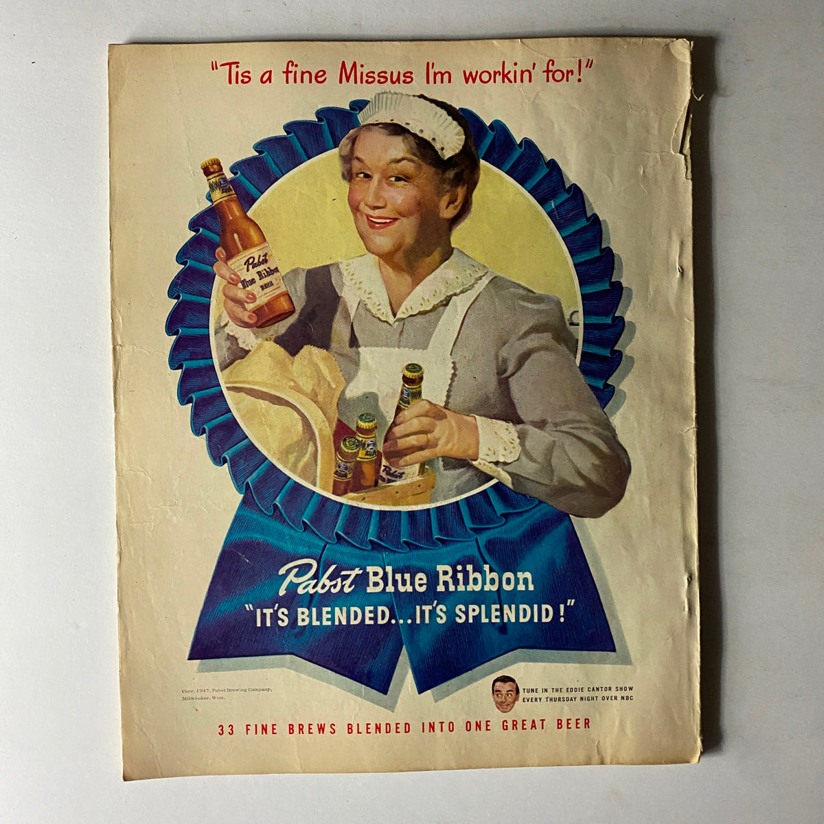 Vintage advertisement for Pabst Blue Ribbon beer, featuring a smiling woman in an apron holding beer bottles, promoting 'It's Blended... It's Splendid!' from the 1947 issue of Sport Magazine.