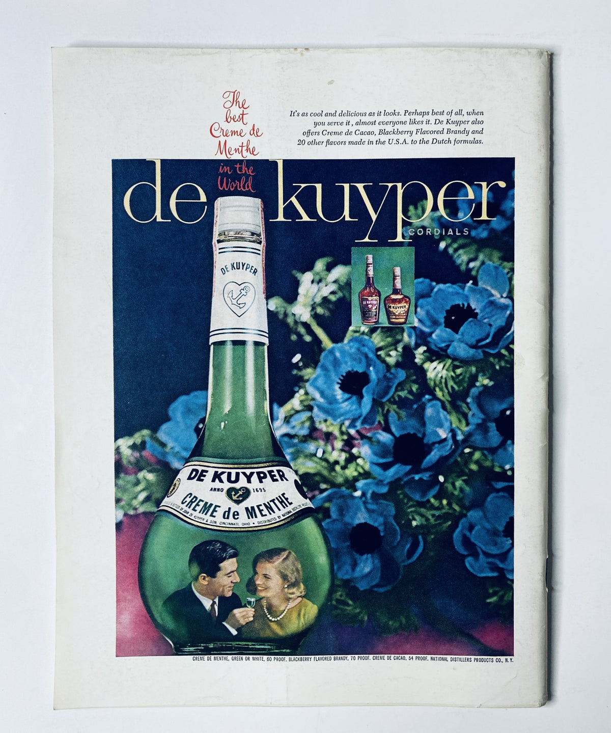 Advertisement page from The New Yorker Magazine February 8, 1964 for de Kuyper cordials, featuring a large bottle of Crème de Menthe and a couple enjoying the drink amidst a floral background.