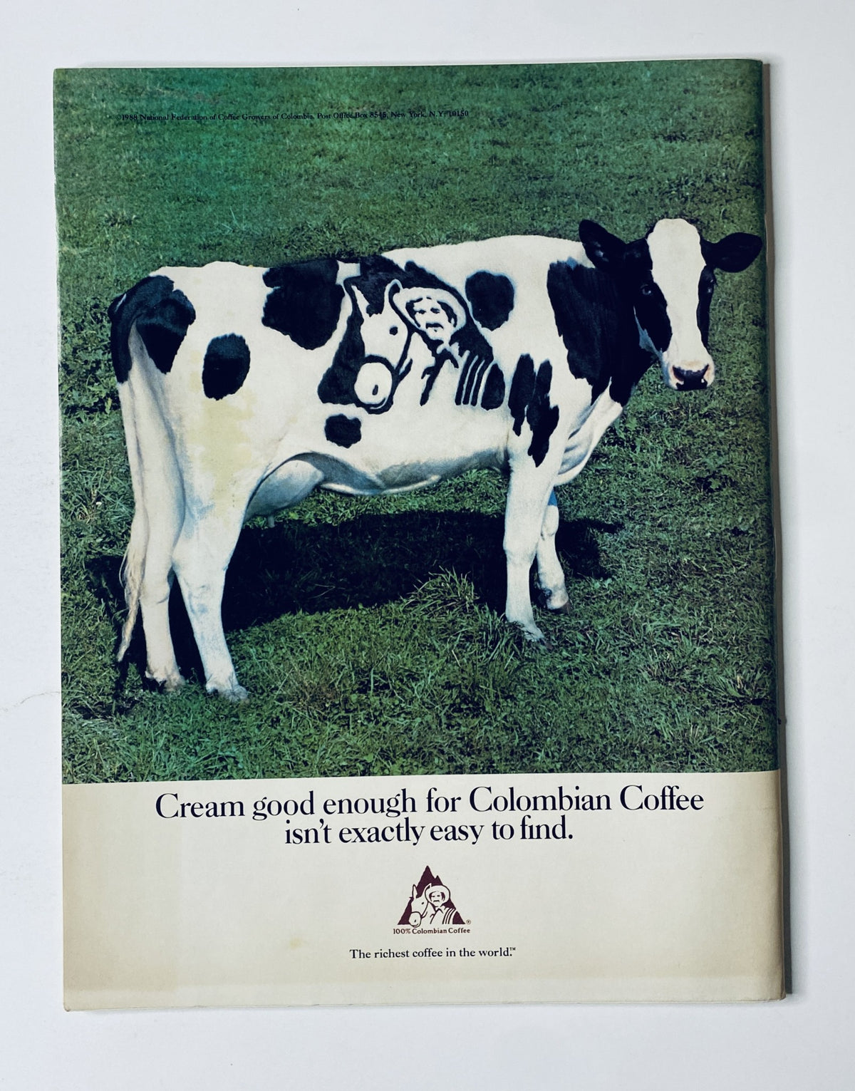 An advertisement with a cow featuring a stylized design, stating 'Cream good enough for Colombian Coffee isn't exactly easy to find' from The New Yorker Magazine January 11, 1988.