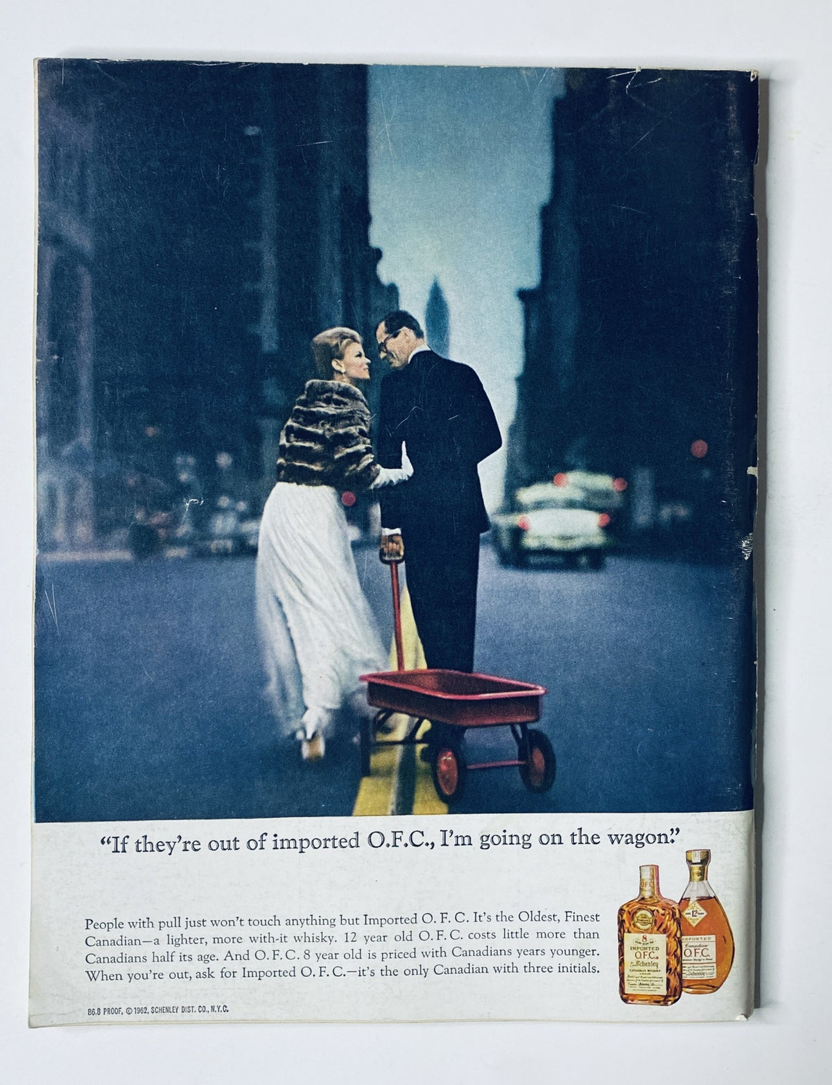 Back cover of The New Yorker Magazine October 26, 1963, advertising O.F.C. whiskey with a vintage image of a couple in a city setting.