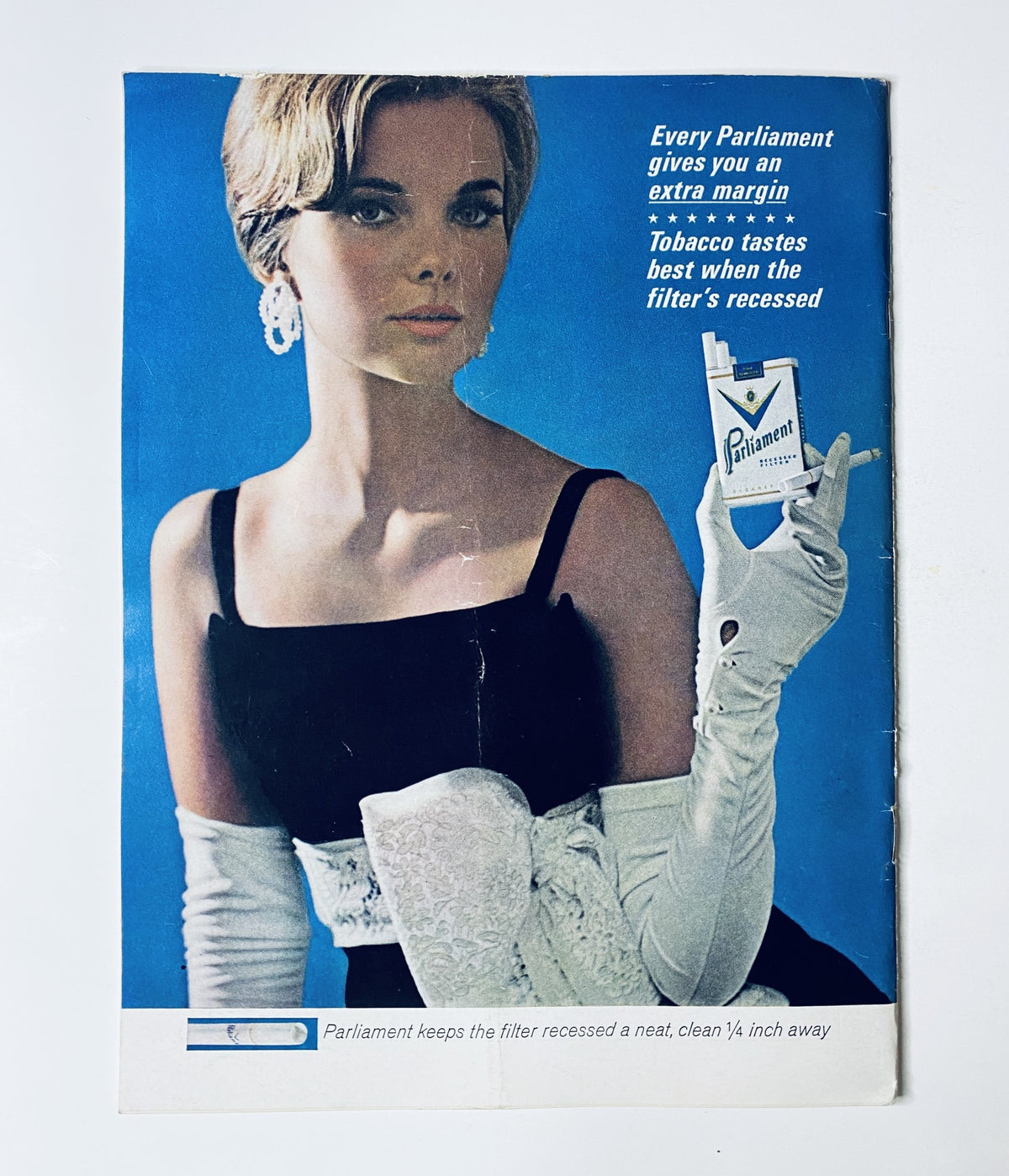 Vintage advertisement from The New Yorker Magazine December 28, 1963, featuring a woman promoting Parliament cigarettes.