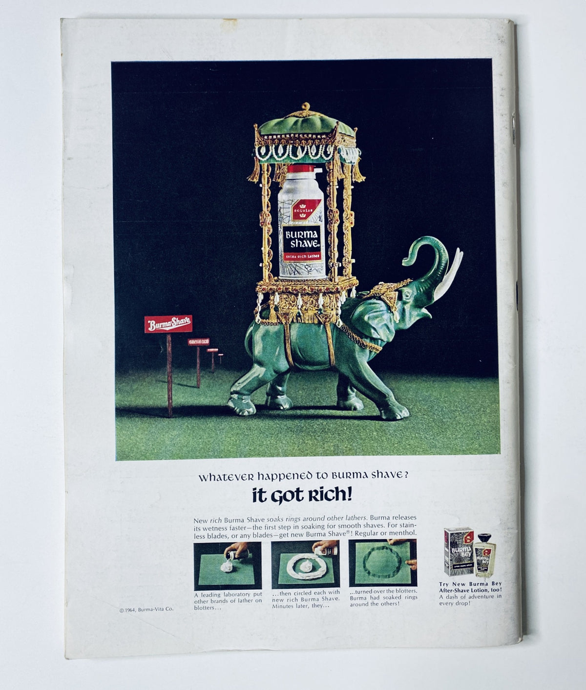 Back cover of The New Yorker Magazine May 16, 1964 featuring an advertisement for Burma Shave with a decorative green elephant structure.