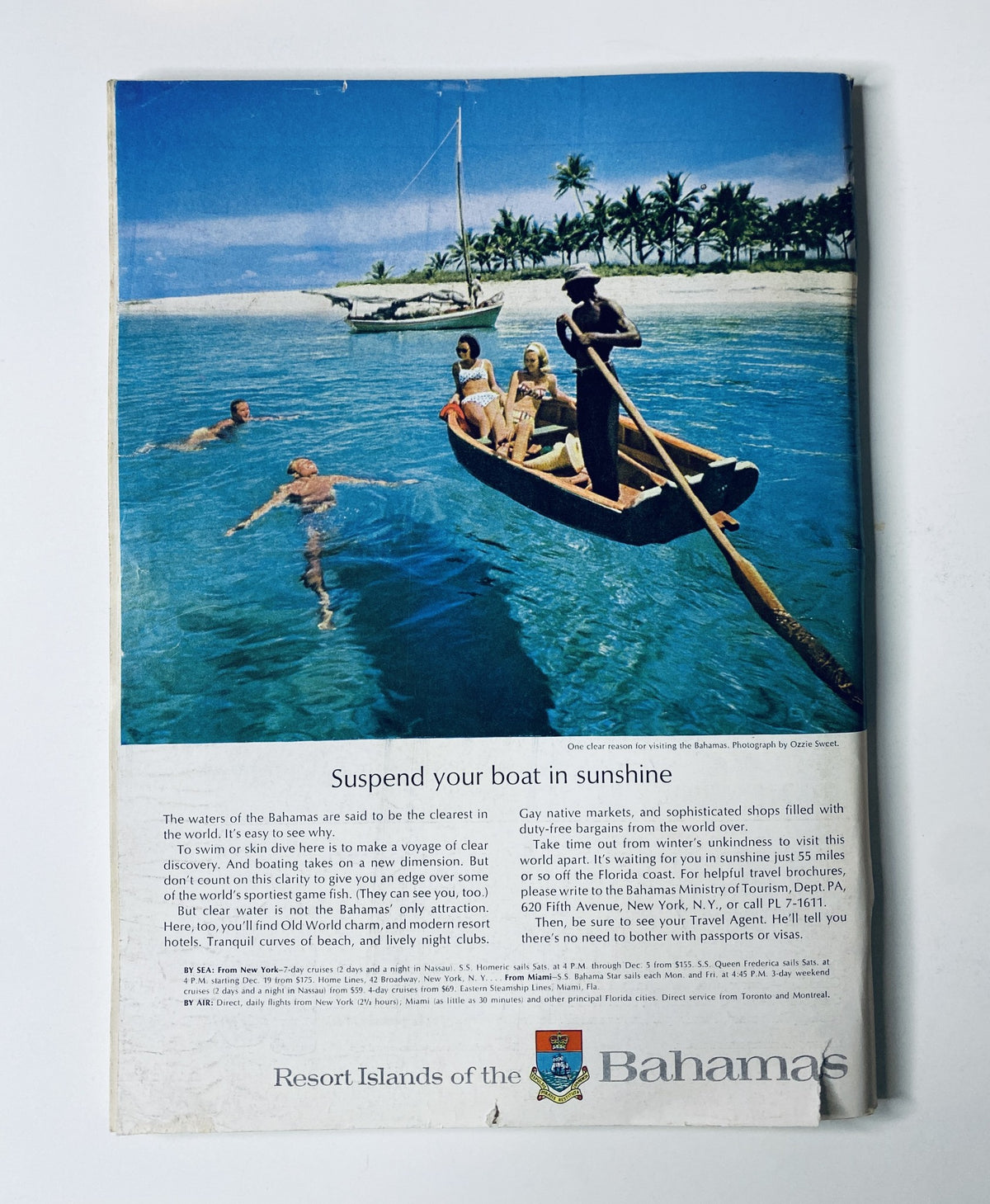 Advertisement for the Resort Islands of the Bahamas from The New Yorker Magazine, November 28, 1964, showcasing a serene beach scene with a boat on clear blue water.