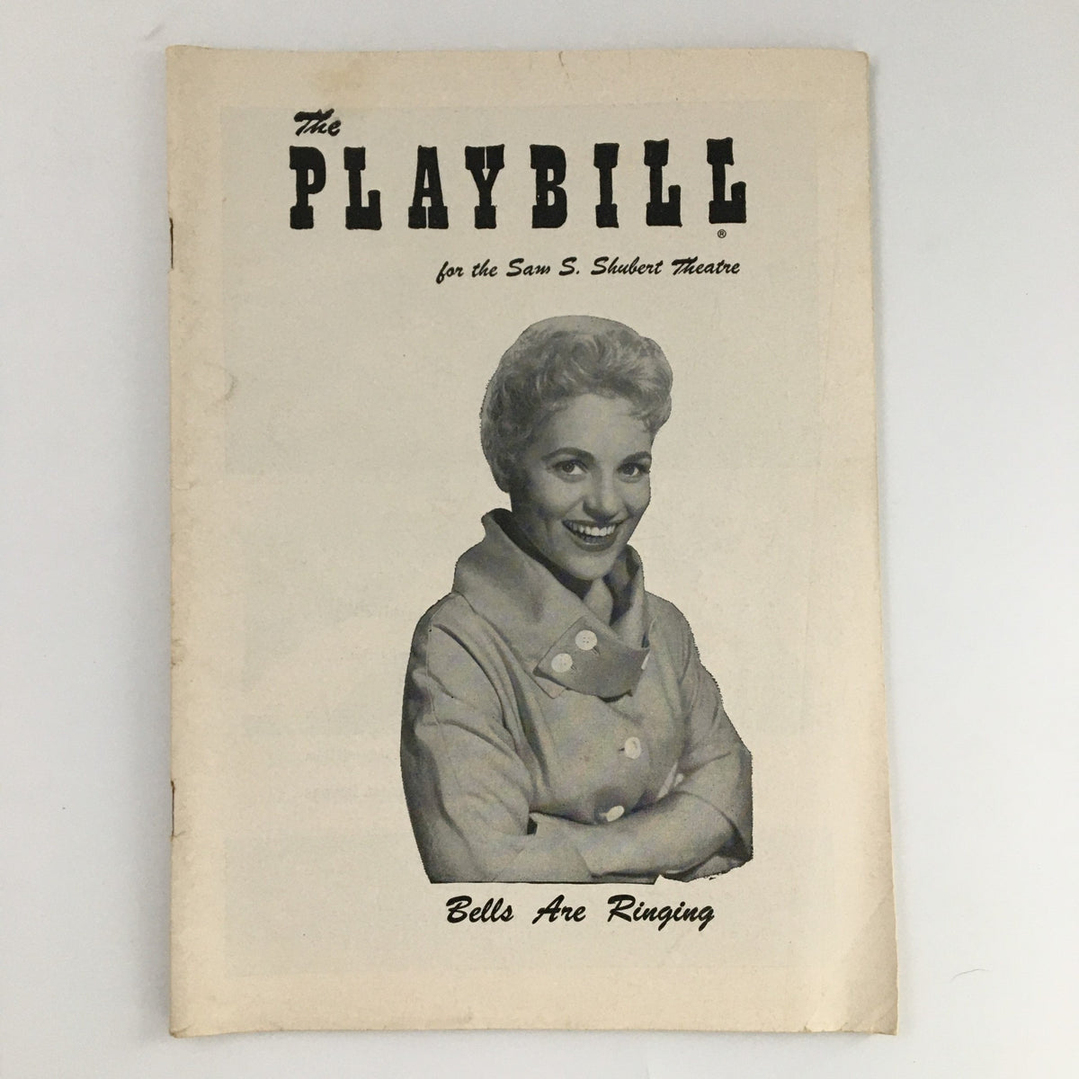 1957 Playbill for the Sam S. Shubert Theatre featuring 'Bells Are Ringing' with a cover image of a smiling actress, capturing the essence of Broadway history.