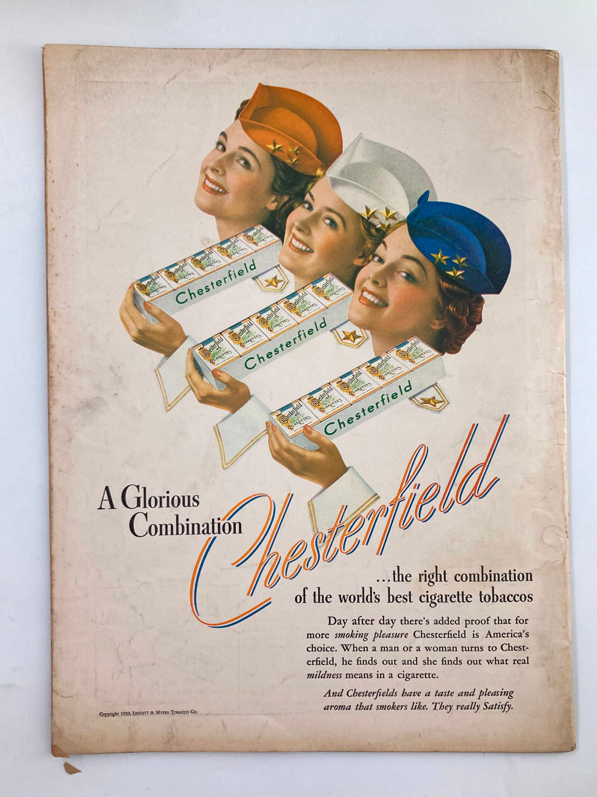 Vintage advertisement for Chesterfield cigarettes on the back cover of VTG Liberty Magazine July 8 1939, showcasing three smiling women with cigarette boxes.