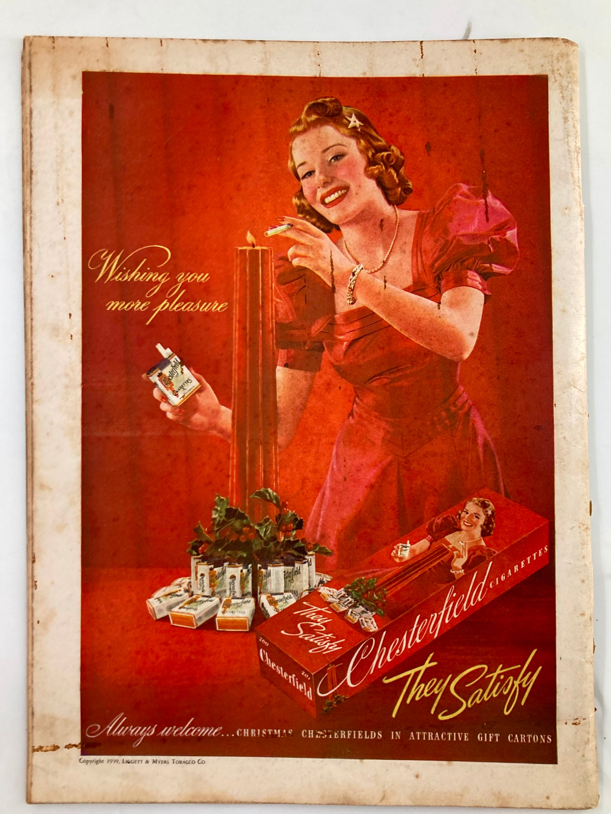 Vintage advertisement from VTG Liberty Magazine December 23 1939, featuring a woman in a red dress promoting Chesterfield cigarettes with the tagline 'They Satisfy'.