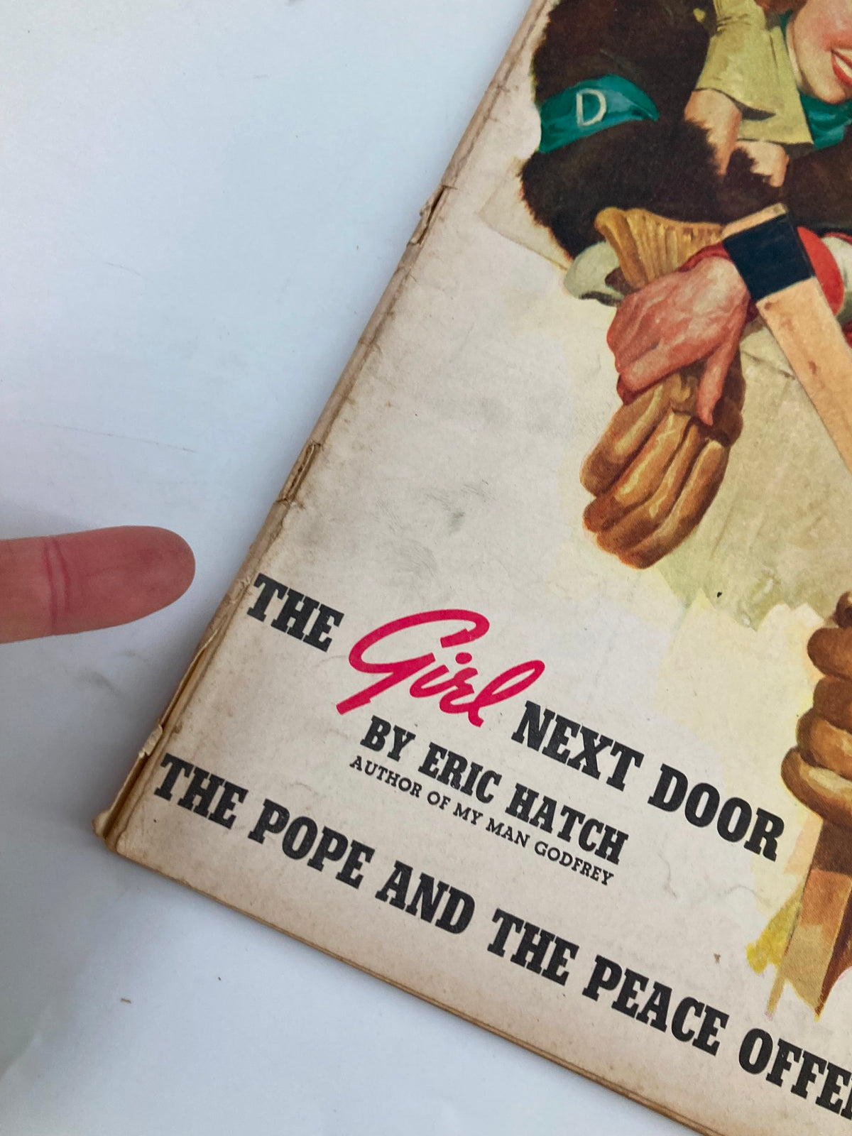 Close-up of Liberty Magazine's cover from March 9, 1940, highlighting the title 'The Girl Next Door' by Eric Hatch with focus on the cover artwork and text details.