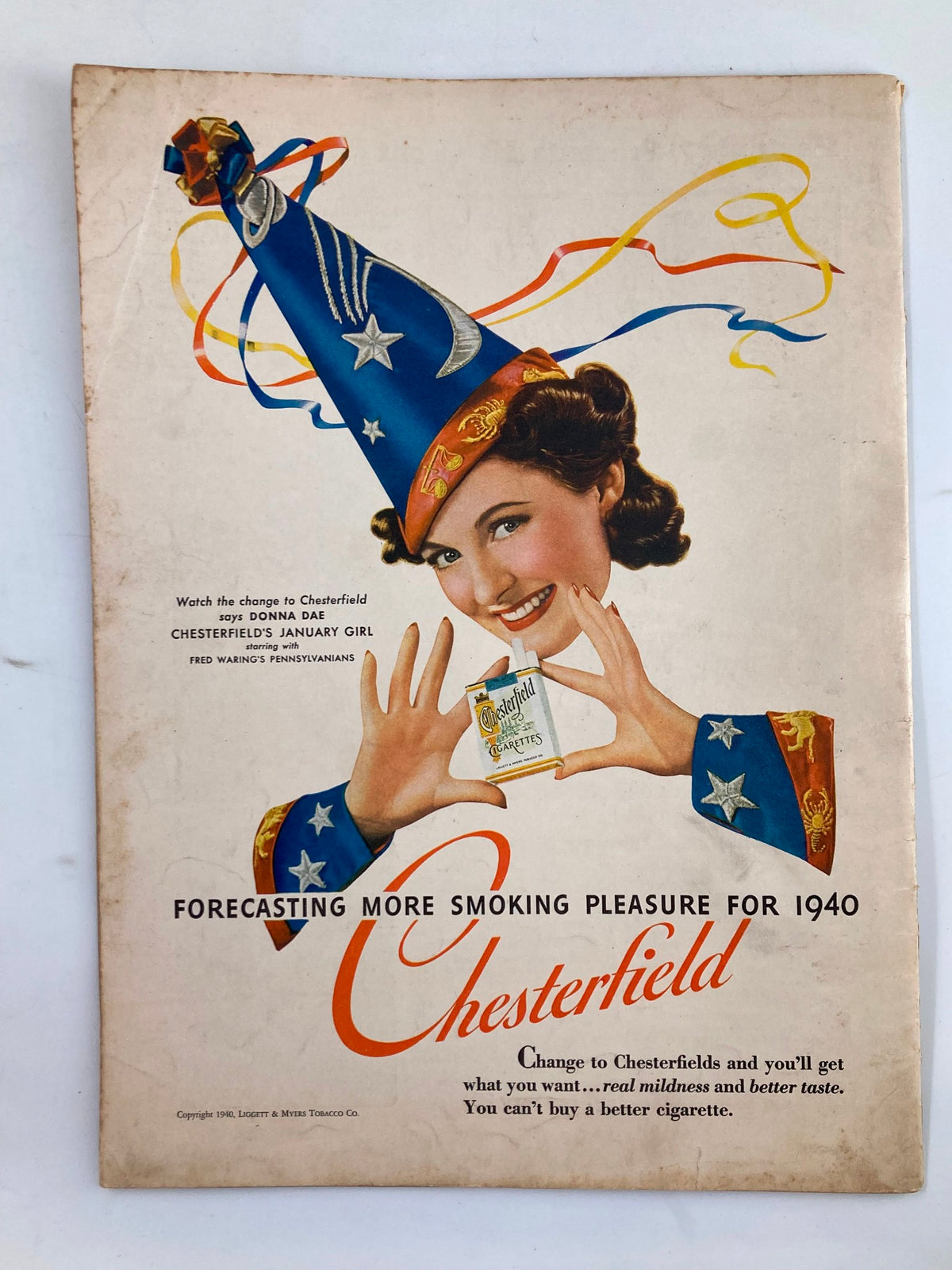 Back cover of VTG Liberty Magazine January 20 1940, featuring a vintage advertisement for Chesterfield cigarettes, showcasing a woman in a festive hat promoting smoking pleasure for the year 1940.