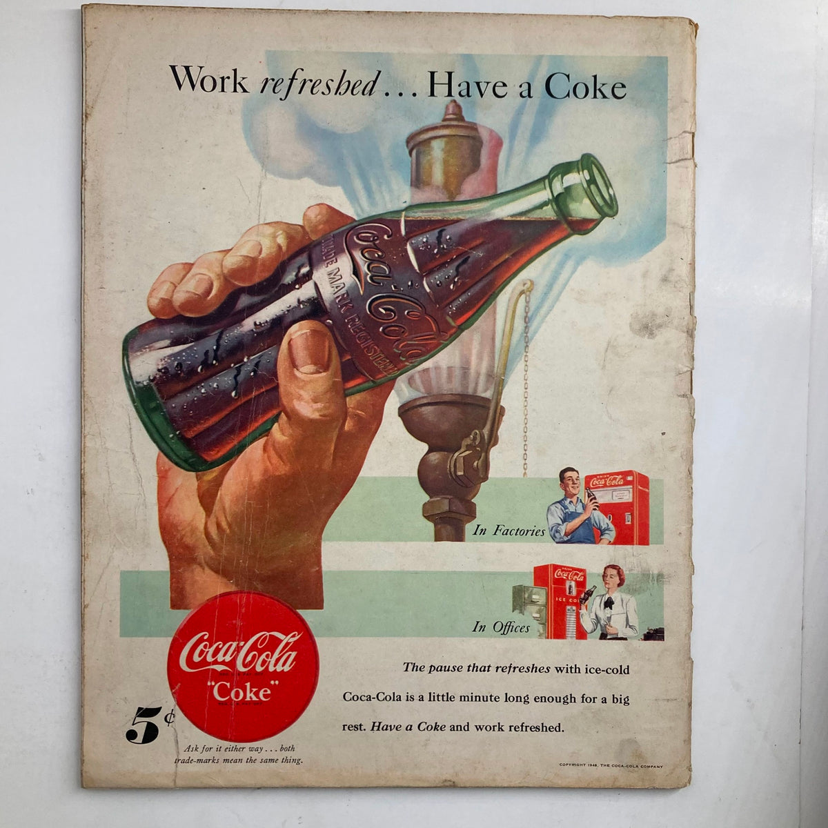 Back cover of VTG Look Magazine, May 11, 1948, advertising Coca-Cola with a vintage illustration of a hand holding a bottle and promoting workplace refreshment.