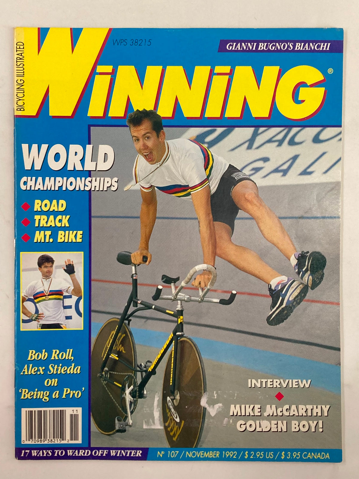 Cover of Winning Bicycle Racing Illustrated, November 1992, Issue No. 107 featuring an energetic Mike McCarthy on a bicycle with a vibrant design. The magazine highlights World Championships in cycling with articles about cycling trends and athletes, making it a collectible item for fans and historians.
