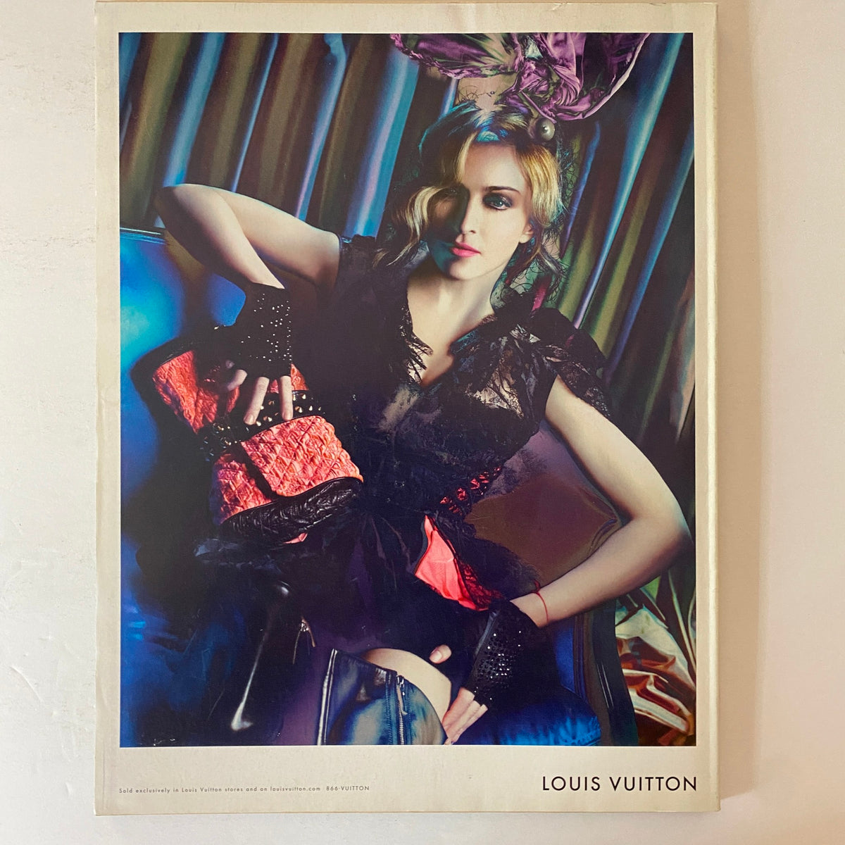 Advertisement for Louis Vuitton in W Magazine November 2009. Depicts a striking model in high fashion clothing, emphasizing luxury and style.