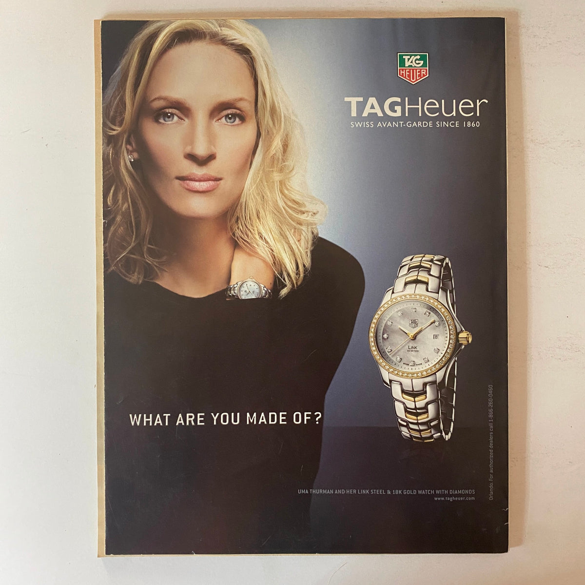 Advertisement for TAG Heuer from W Magazine January 2007, featuring a model wearing jewelry and a watch, promoting elegance and sophistication in fashion.
