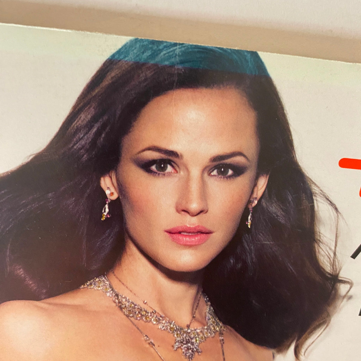 Close-up of Jennifer Garner featured in the January 2010 issue of W Magazine, highlighting her glamorous makeup and jewelry.
