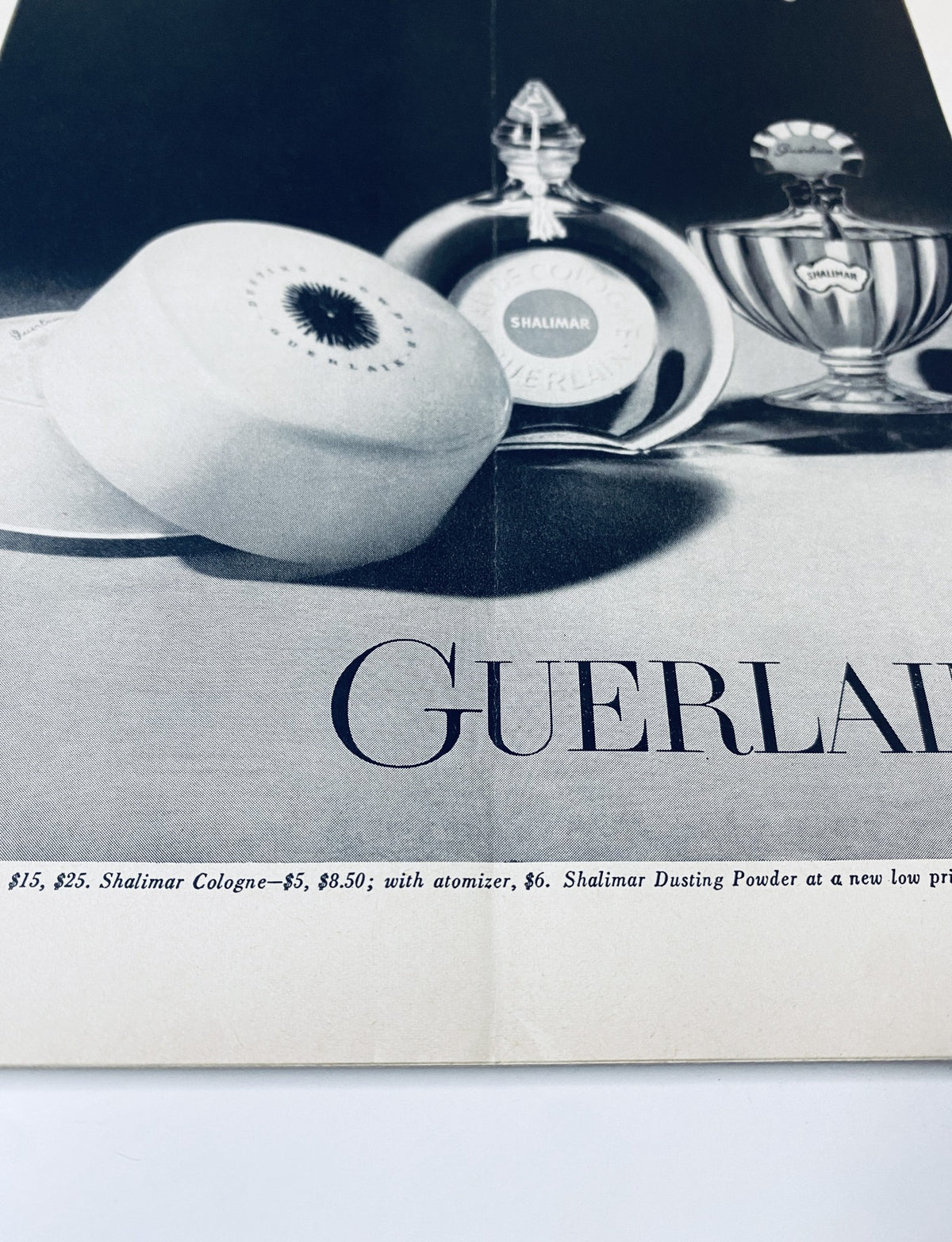 An advertisement from The New Yorker Magazine January 25, 1964 for Guerlain products, featuring Shalimar Cologne and Shalimar Dusting Powder.