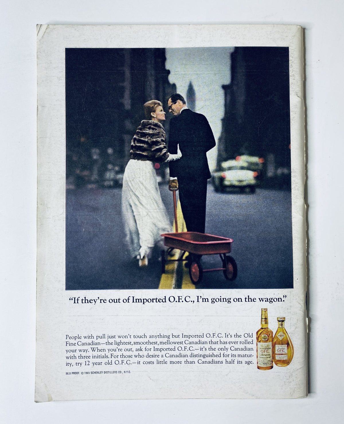 Back cover of The New Yorker Magazine June 5, 1965, displaying an advertisement for Imported O.F.C. with a couple dressed elegantly, capturing an urban scene with a vintage flair.