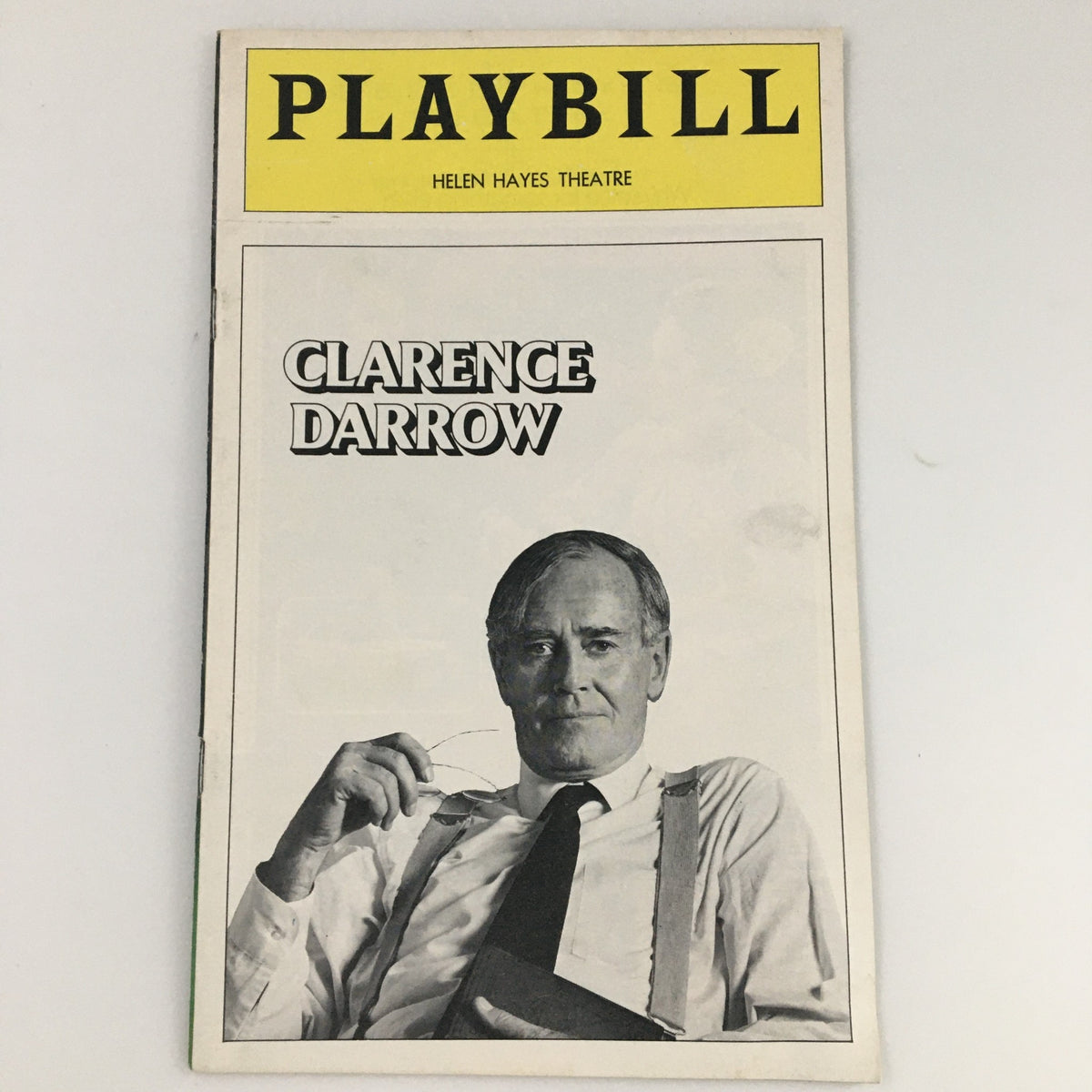 1974 Playbill for 'Clarence Darrow' featuring a cover image showcasing a distinguished man holding glasses, representing the theatrical production starring Henry Fonda at Helen Hayes Theatre.