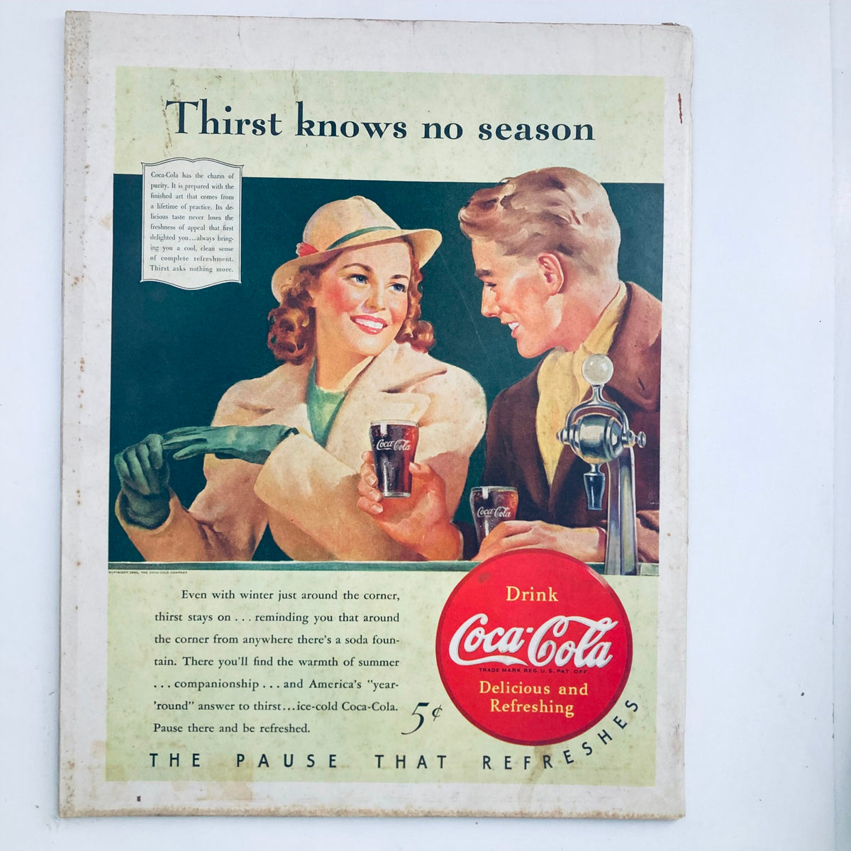 Back cover of The Saturday Evening Post Magazine dated November 16, 1940, featuring a Coca-Cola advertisement with a couple enjoying refreshments.