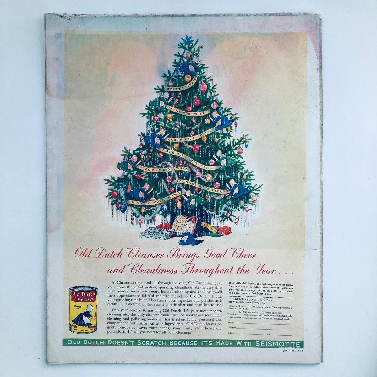 Back cover of The Saturday Evening Post Magazine dated December 7, 1935, showcasing an advertisement for Old Dutch Cleanser, featuring a decorated Christmas tree and promotional text emphasizing cleanliness.