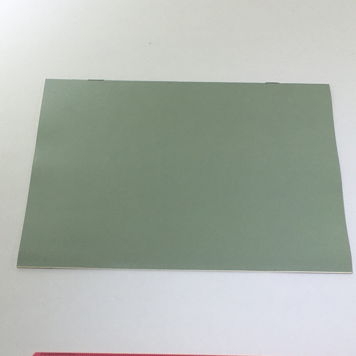 Back cover of the Vintage 1976 Lincoln Continental Town Car Opt. Coach Roof Car Catalog Brochure, featuring a plain green design.