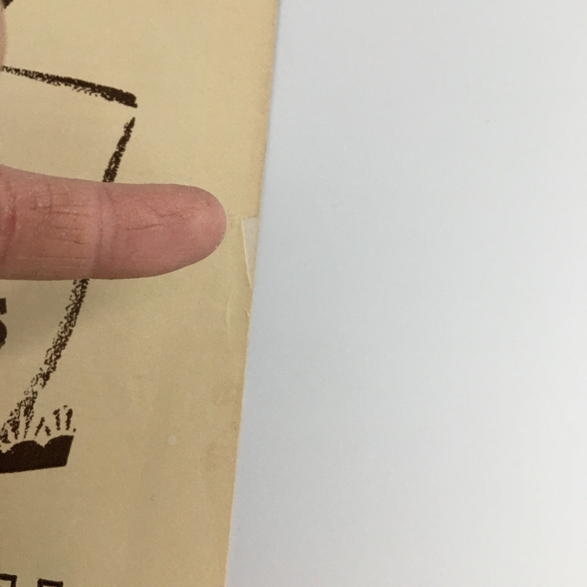 Close-up of the 1944 Playbill for 'Carmen Jones' showing minor wear and a small rip, highlighting its vintage character.