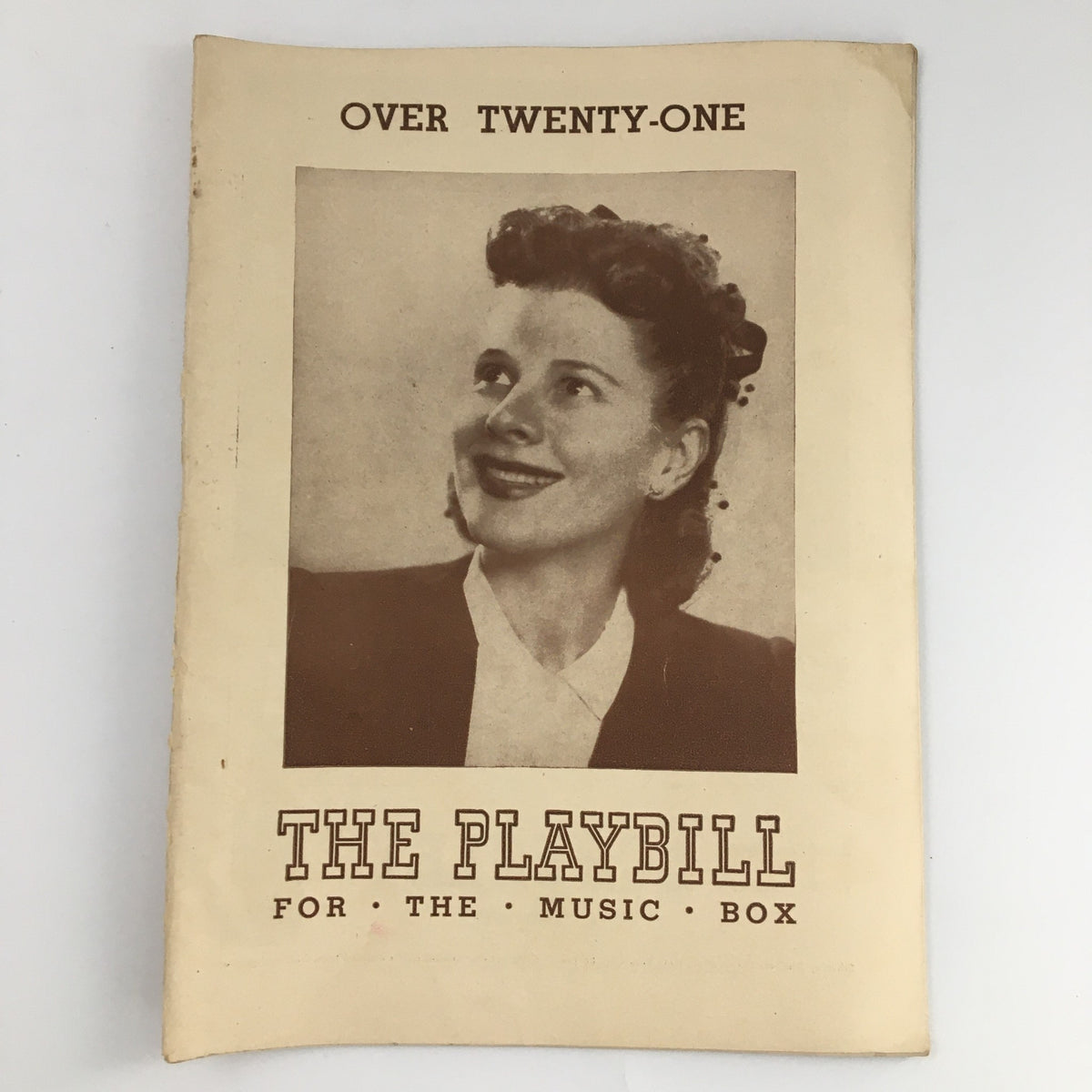 1944 Playbill for The Music Box production of 'Over Twenty-One,' featuring a vintage cover portrait and iconic performances.