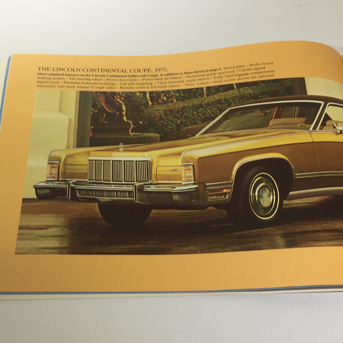 Interior page of the Vintage The 1975 Continentals Town Coupe/Town Car/Mark IV Car Catalog Brochure featuring the Lincoln Continental Coupe in gold, emphasizing its classic design.