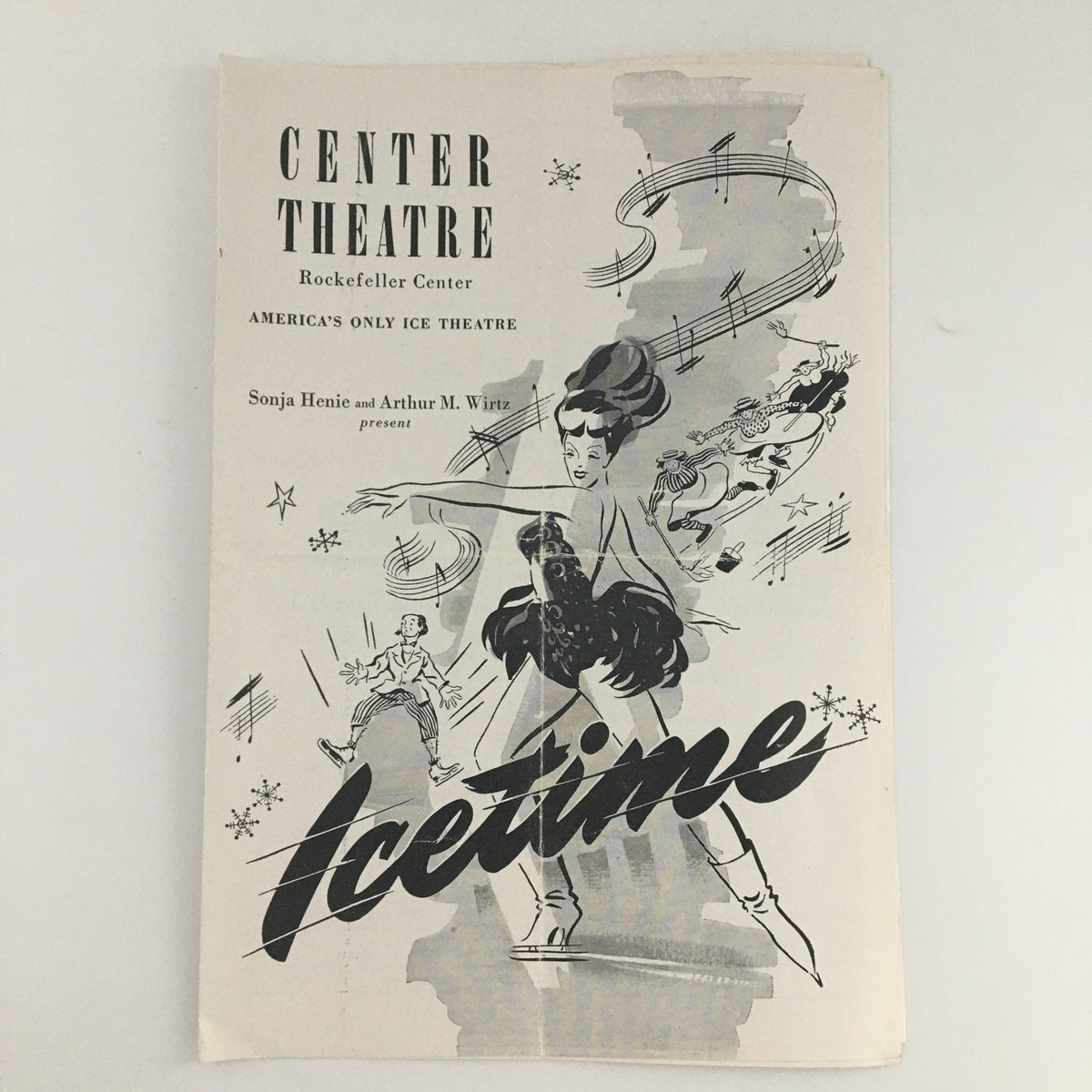 1946 Center Theatre Rockefeller Center 'Icetime' program featuring a dynamic illustration of a figure skater, showcasing the theatrical performance details.