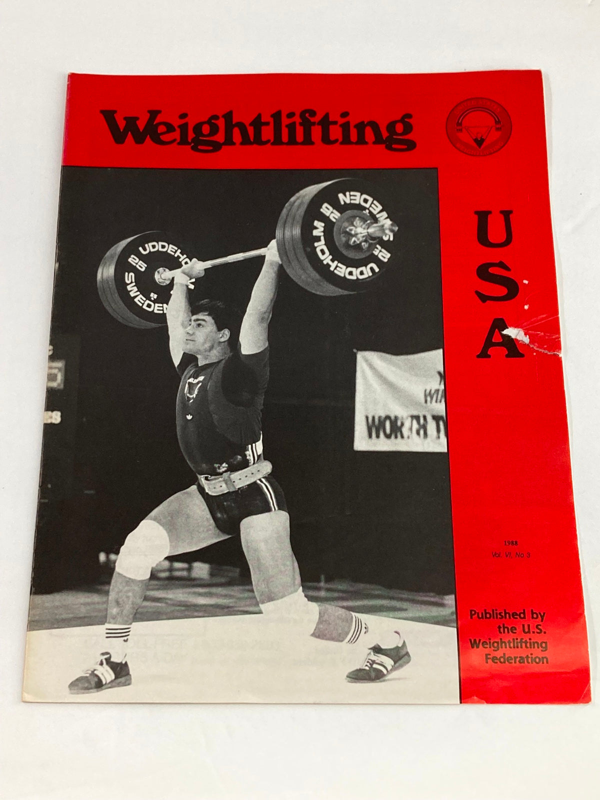 Cover image of Weightlifting USA Magazine 1988 Vol 6 #3, featuring a weightlifter performing a lift with a red background and title.