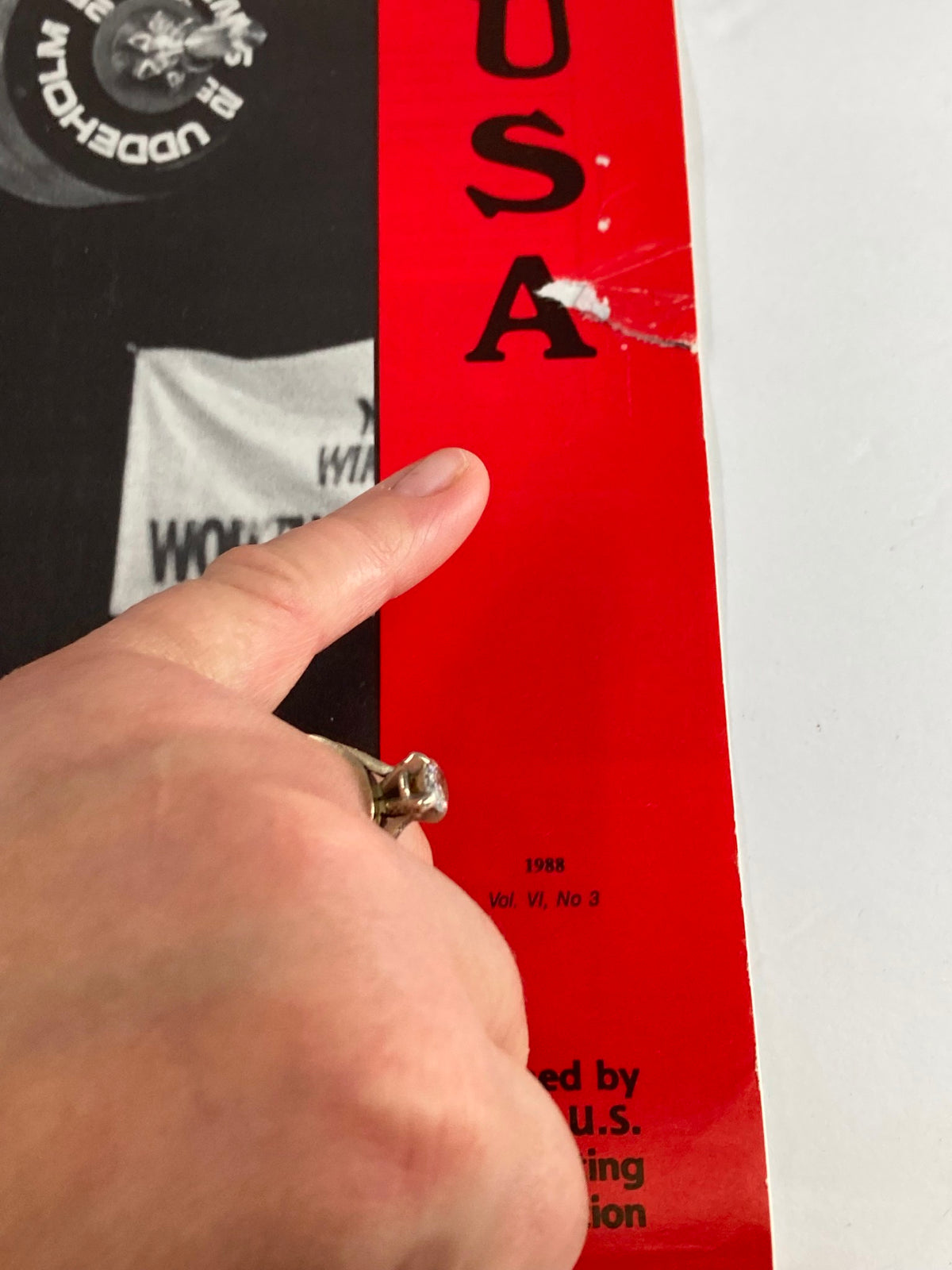 Close-up of the spine and corner of Weightlifting USA Magazine 1988 Vol 6 #3, showcasing wear and publication details.