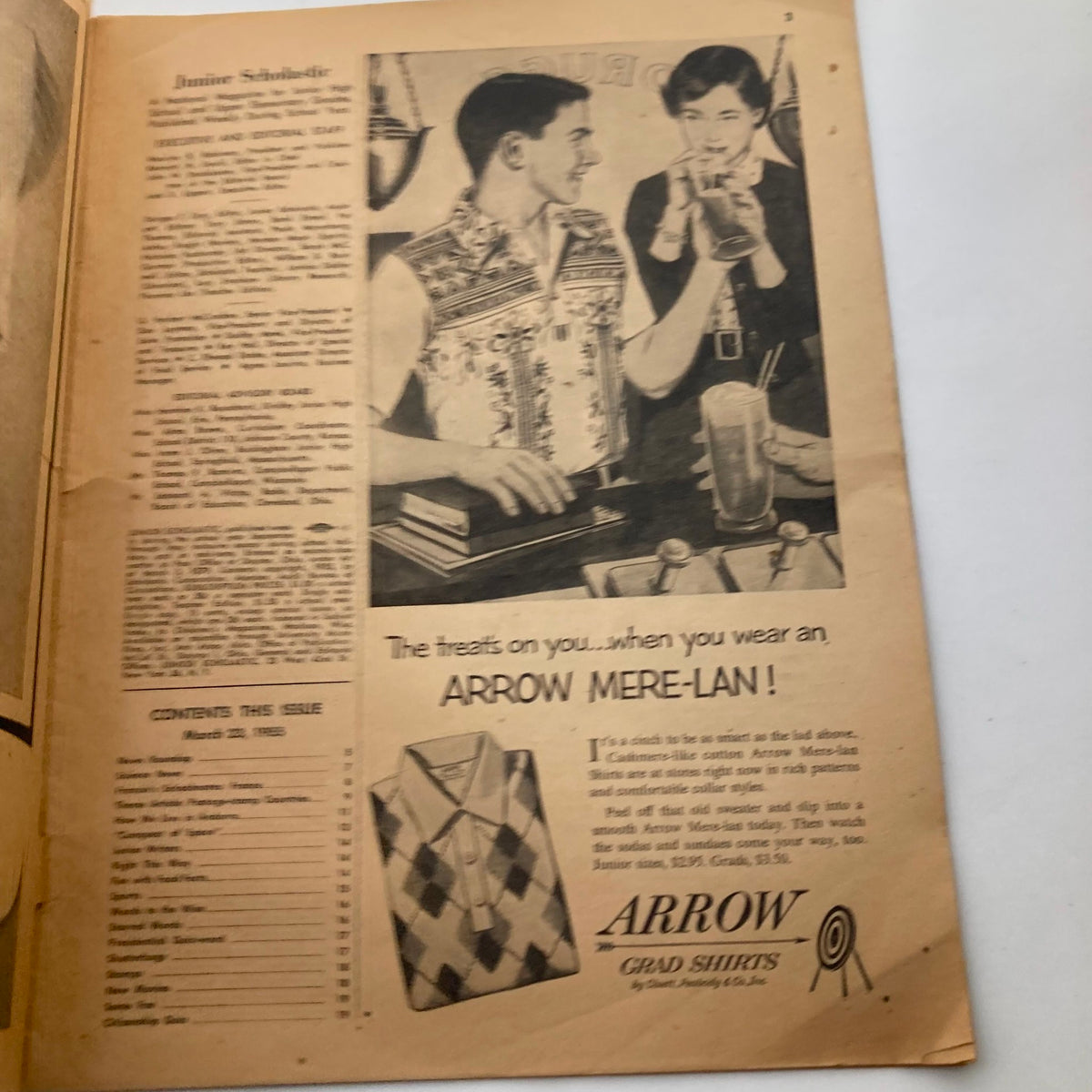 Inside page of VTG Junior Scholastic Magazine March 23, 1955 showcasing an advertisement for Arrow Mere-Lan shirts among magazine content.