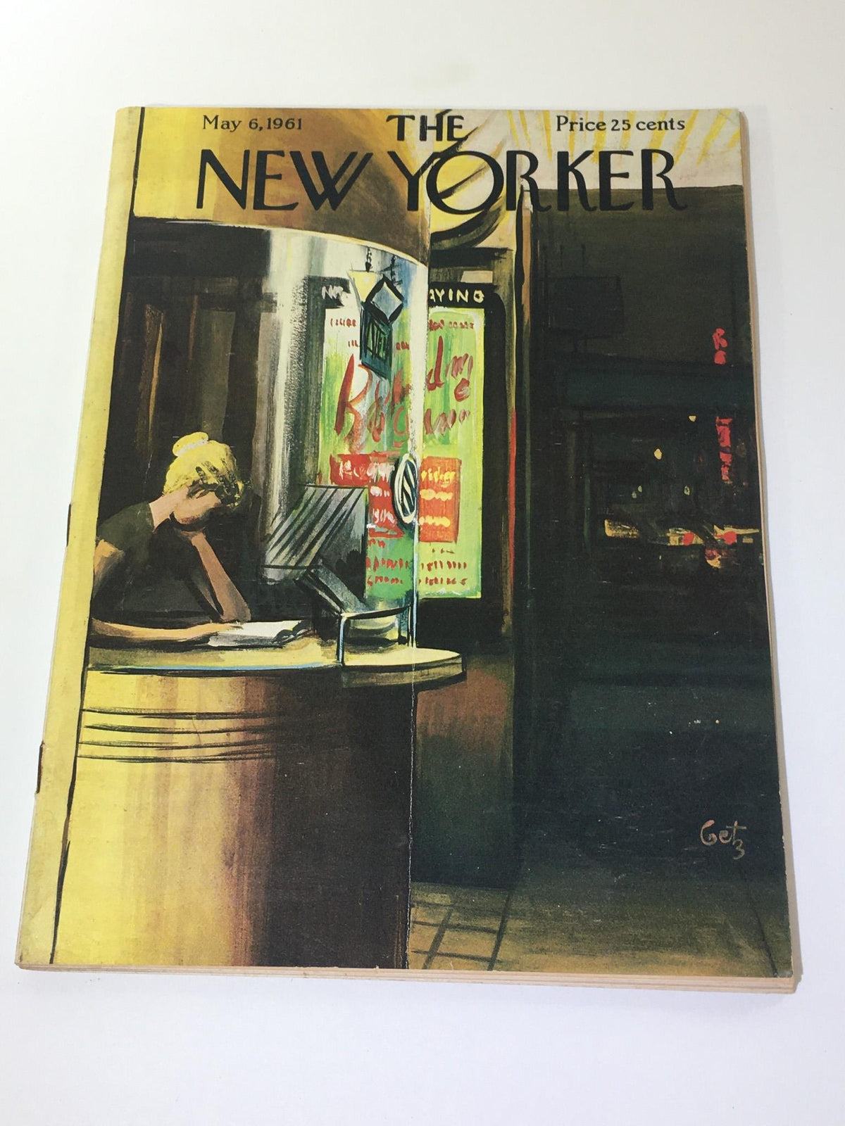 The New Yorker magazine cover from May 6, 1961, featuring artwork by Arthur Getz, depicting a woman at a counter with city street scenery and vintage advertisements.
