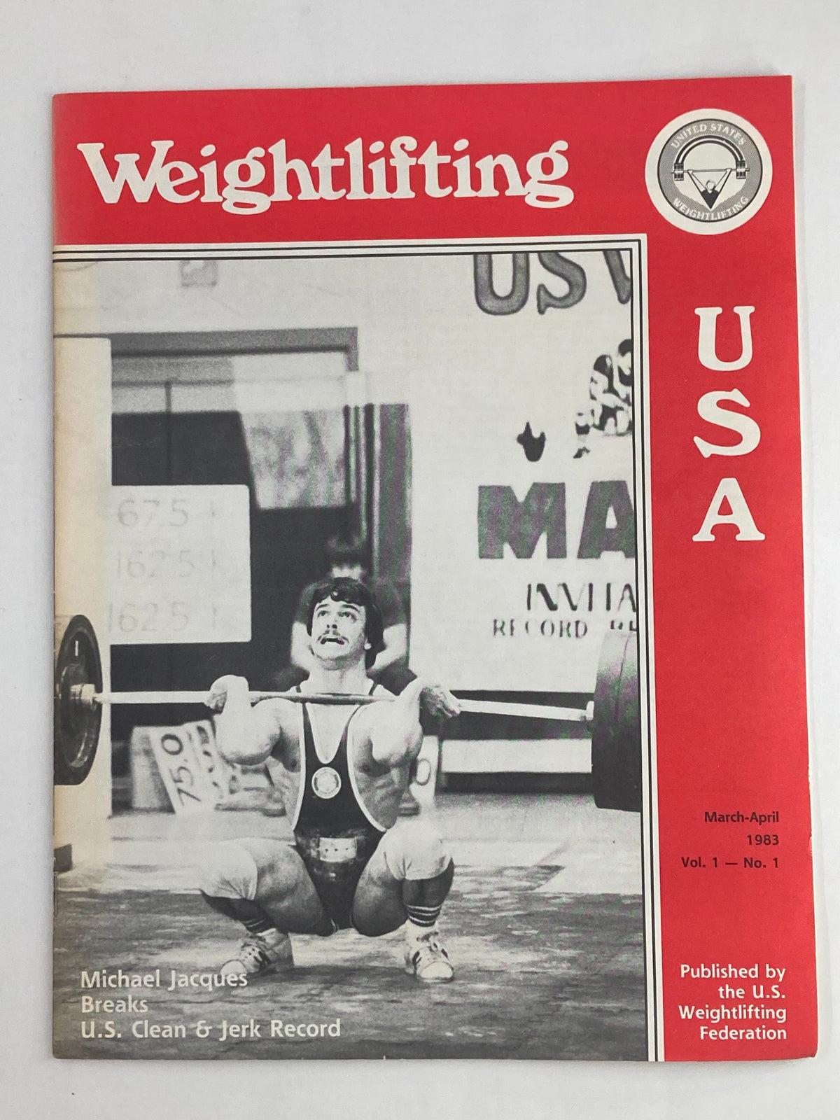 Cover of VTG Weightlifting USA Magazine Vol 1 #1 March 1983 featuring Michael Jacques, showcasing his record-breaking clean and jerk lift.