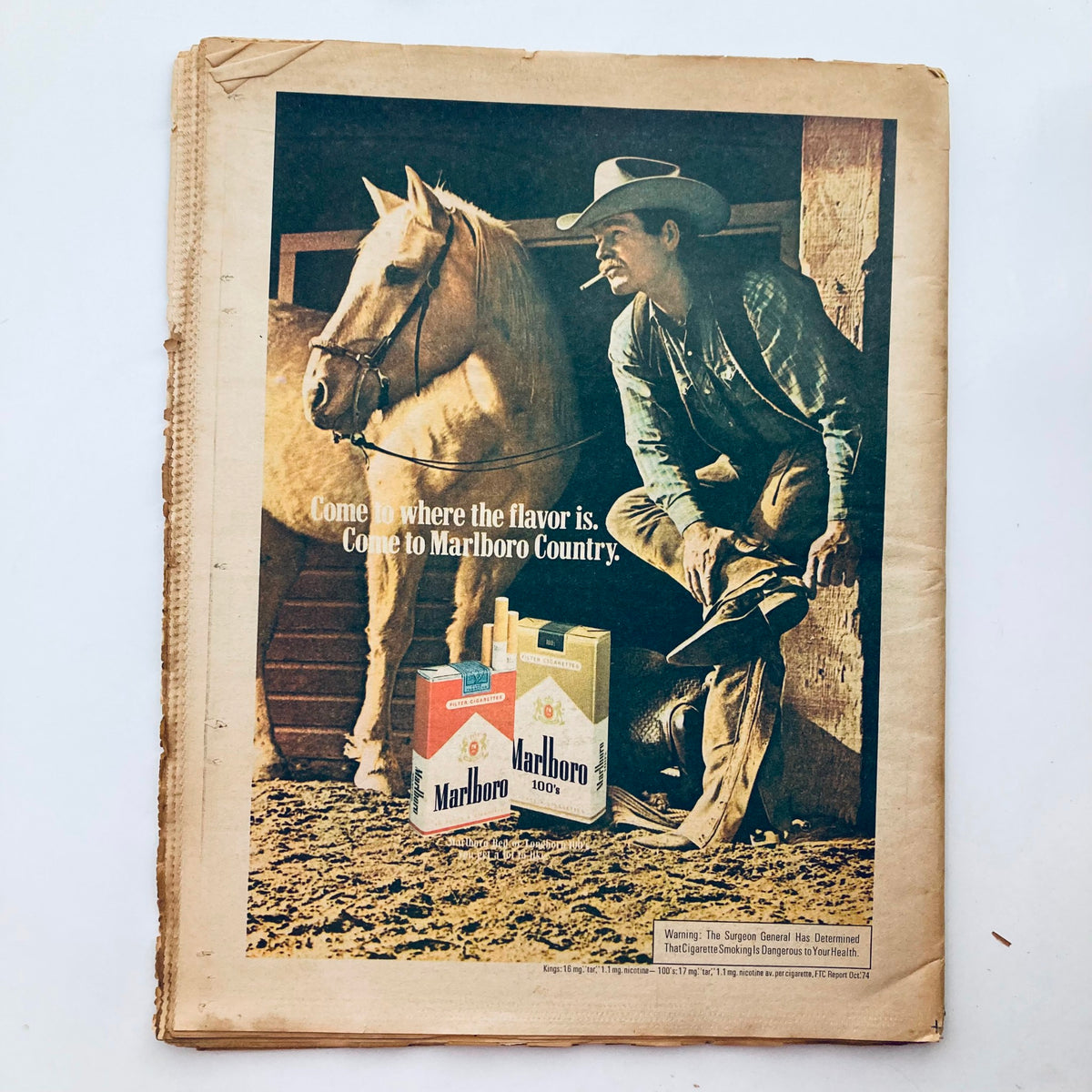 Back cover of the VTG Rolling Stone Magazine May 8 1975 Issue 186, featuring a vintage Marlboro advertisement with a cowboy and a horse, showcasing classic 1970s advertising style.