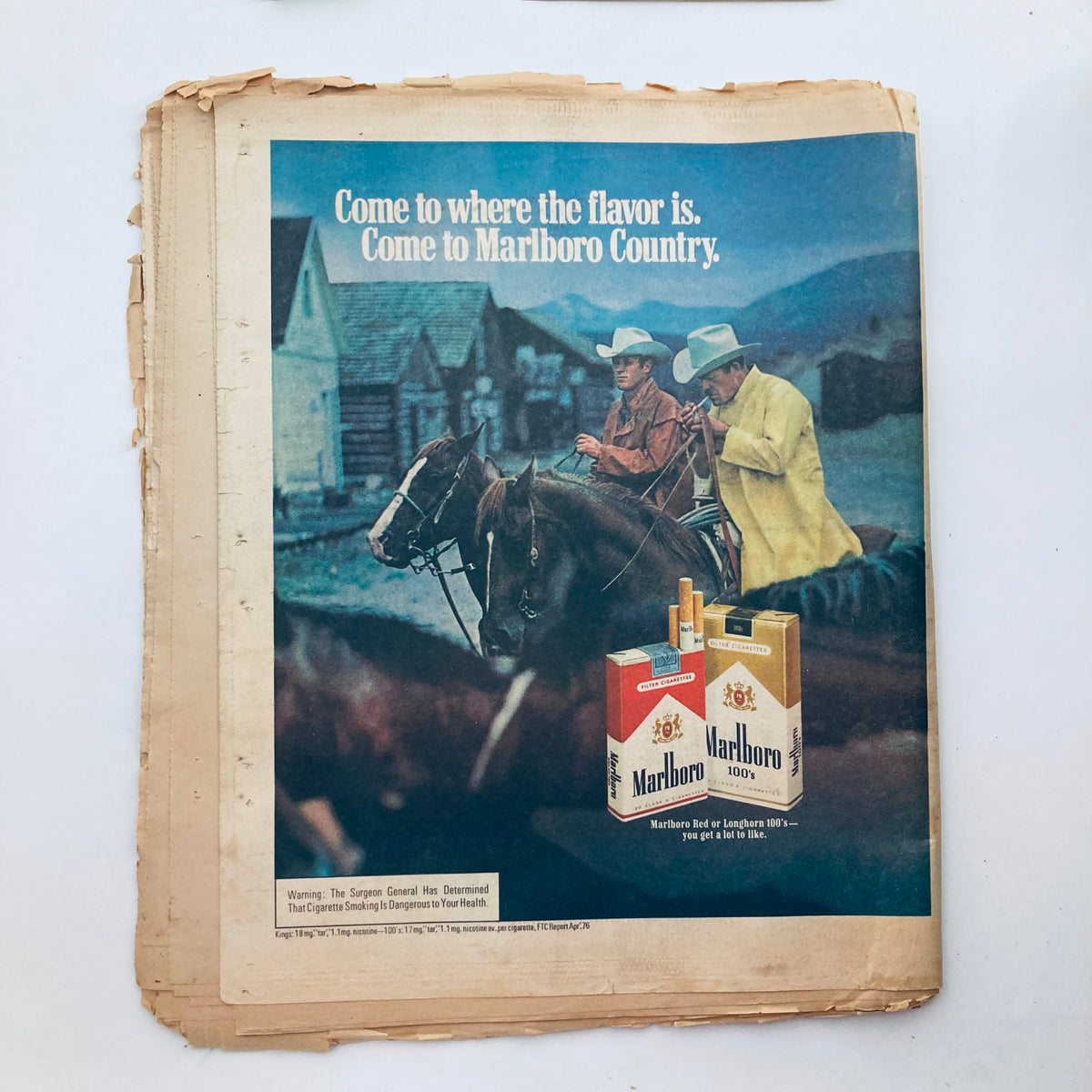 Advertisement page from Vintage Rolling Stone Magazine July 15, 1976 Issue 217, featuring a Marlboro cigarette ad with two cowboys on horseback.