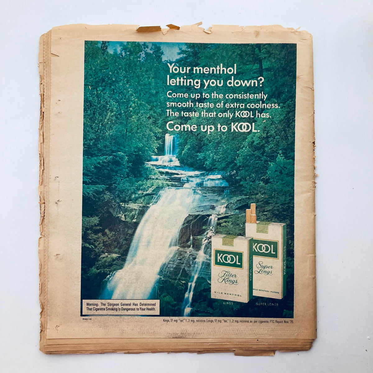 Advertisement for Kool cigarettes from the VTG Rolling Stone Magazine April 8, 1976 Issue 210, showcasing a scenic waterfall backdrop.