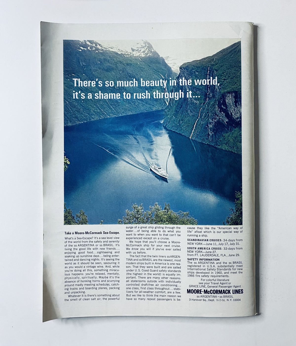 An advertisement from The New Yorker Magazine February 22, 1969 featuring a scenic view of a fjord with a ship on the water, accompanied by the text 'There's so much beauty in the world, it’s a shame to rush through it...' This image exemplifies the magazine's artistic design and visual appeal, aligning with its historical significance.