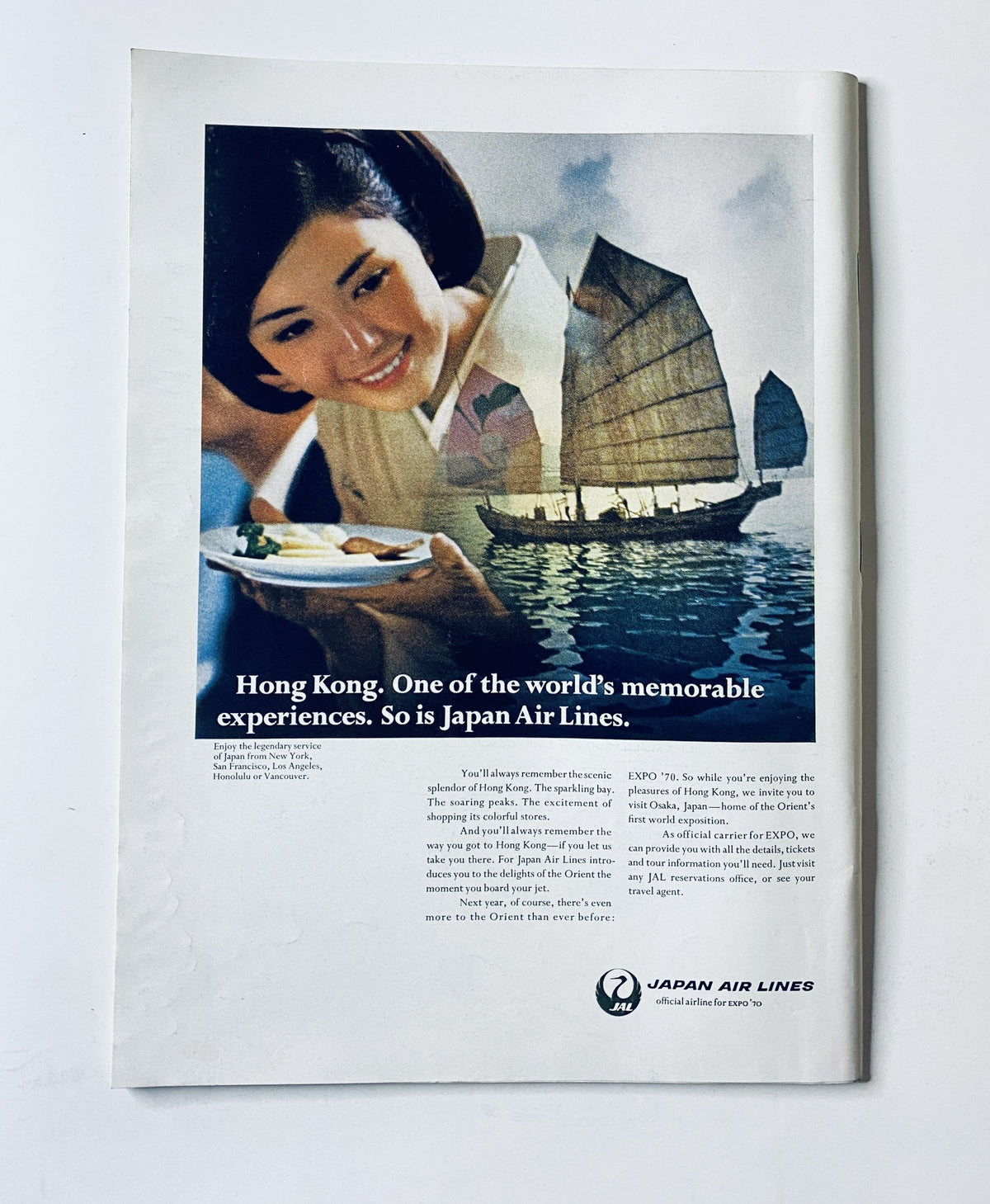 Advertisement page from The New Yorker Magazine July 19, 1969, promoting Japan Air Lines with an attractive image of a woman enjoying food beside traditional sailing boats in Hong Kong.