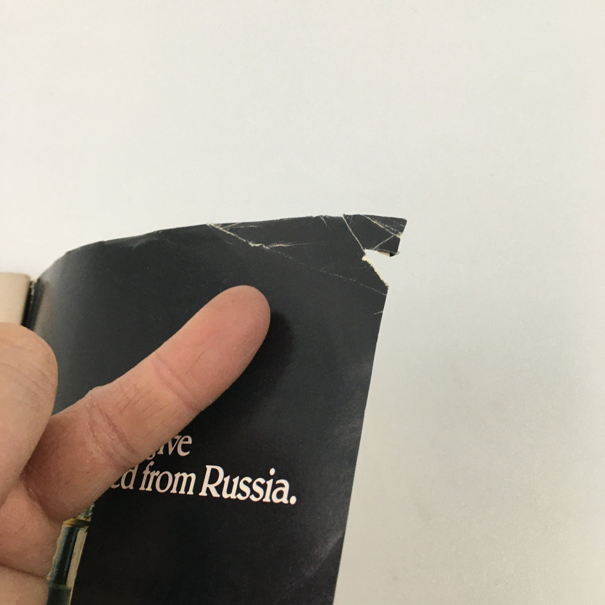 Close-up of damaged corner of 1980 Playbill for 'Night and Day' at Anta Theatre, showing visible tearproof.