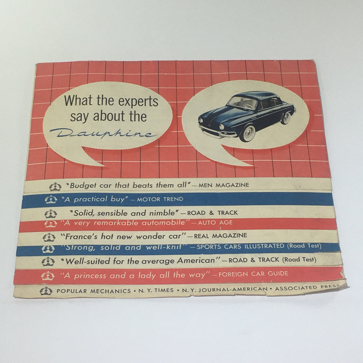 Vintage 1955 Renault Dauphine 250-HP 2-Door Sedan Gas-Gobbling Car Catalog cover featuring expert reviews and endorsements from popular automotive publications.