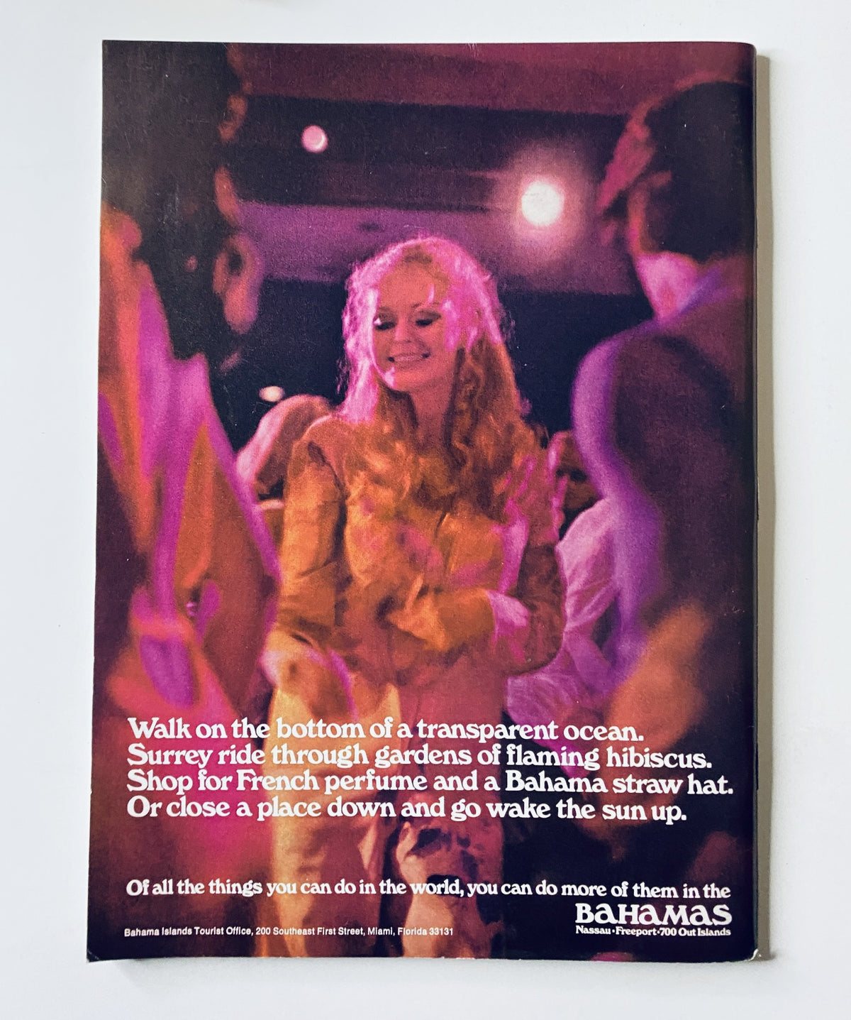 Back cover advertisement of The New Yorker Magazine from April 11, 1970 promoting activities in the Bahamas, featuring a blonde woman dancing, illustrating travel and leisure themes.