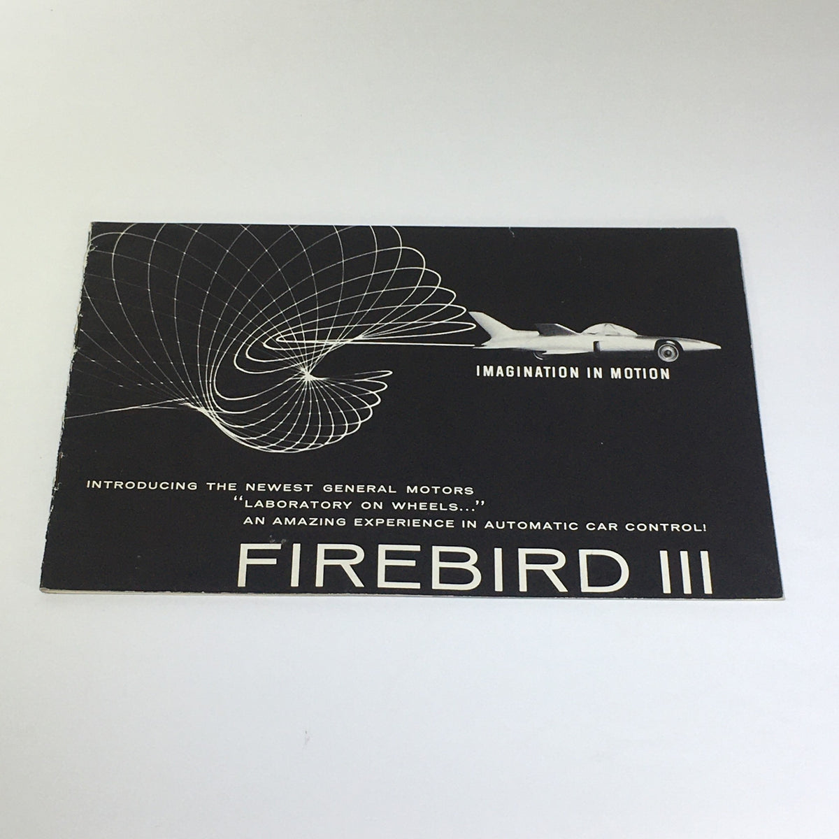Cover of the Vintage The New Firebird III - Fire I & II Electro-Hydraulic Control Car Catalog featuring sleek design and tagline 'Imagination in Motion'.