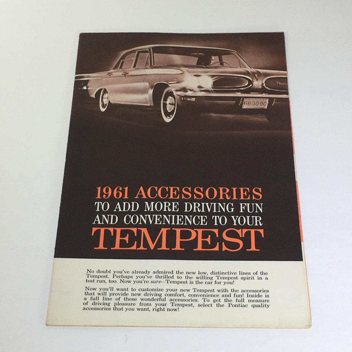 Vintage 1961 Accessories To Add for your Tempest - Wheel Trim Rings Car Catalog cover showcasing a classic car with bold text offering driving fun and convenience for the Tempest.