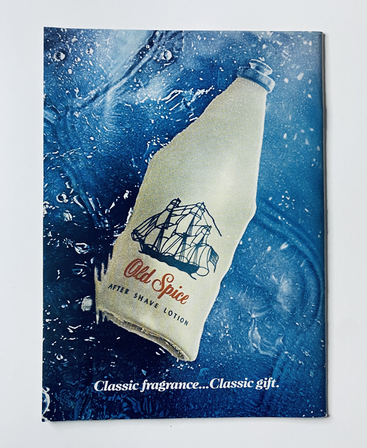Ad page from The New Yorker Magazine July 31, 1971, featuring an Old Spice after shave lotion advertisement with a visual of a vintage bottle against a blue water background.