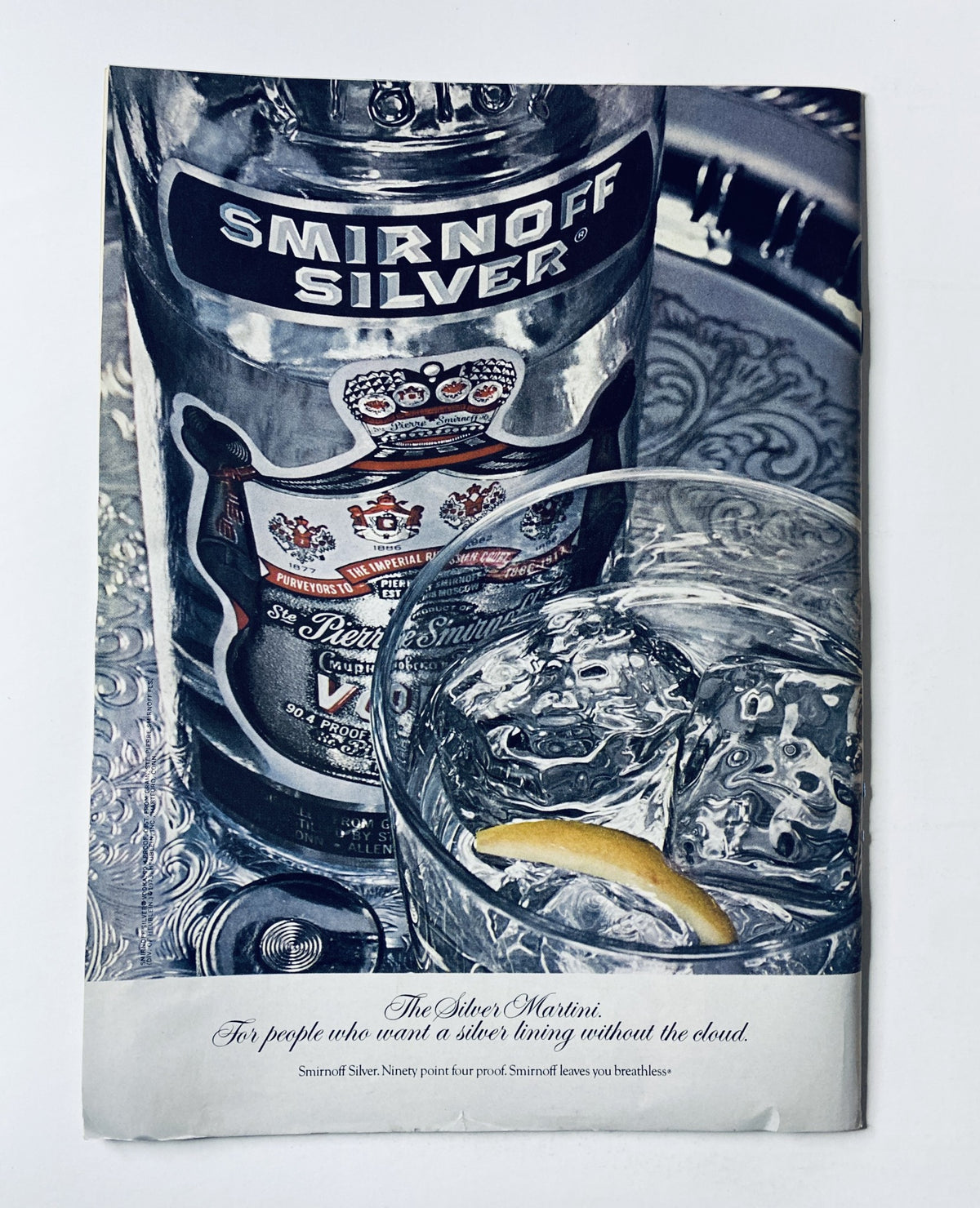 Advertisement page from The New Yorker Magazine July 30, 1973 showcasing Smirnoff Silver vodka with a glass and lemon garnish.
