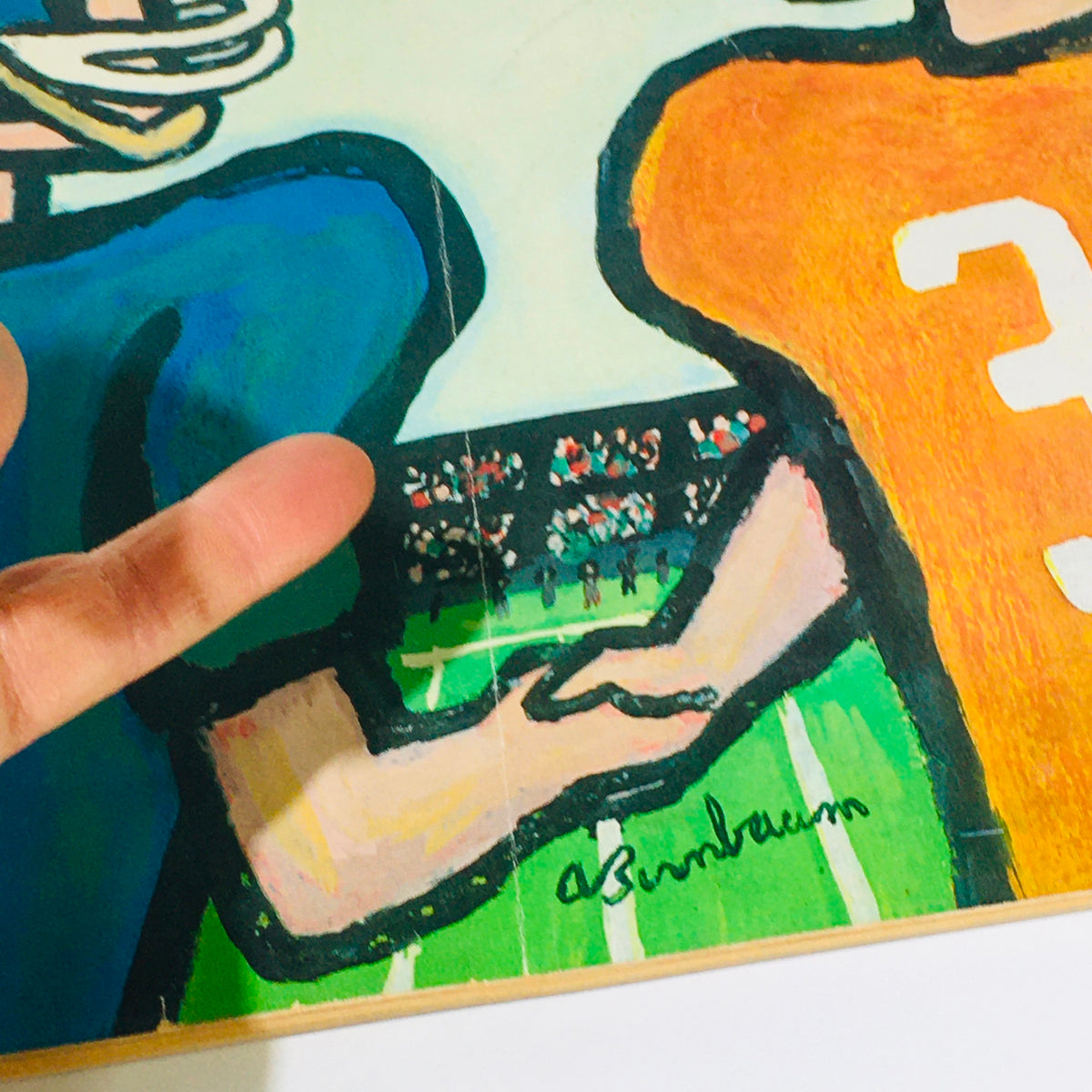 Cover art from The New Yorker: October 29, 1960 magazine by Abe Birnbaum, featuring stylized illustrations of two football players in vibrant colors, showcasing an engaging sports theme.