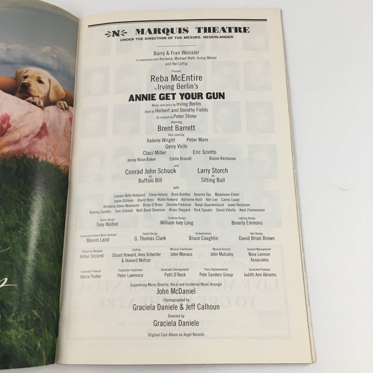 Cast list page of the 2001 Playbill for Annie Get Your Gun, detailing performers including Conrad John Schuck and Larry Storch at the Marquis Theatre.